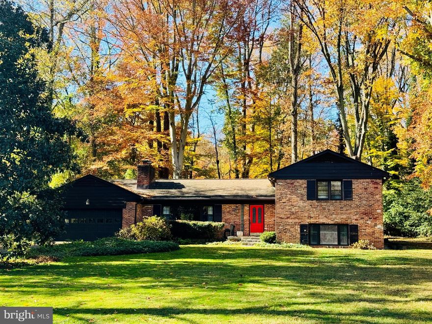 Quality-built all brick split-level home on 0.71 acres in Mantua. Over 3,750 finished square feet. this home is situated in a prime location in the neigbhorhood; a beautiful street comprised of larger lots and just a few yards from the entrance to Eakin Park.   Tastefully updated throughout and well maintained.  Kitchen is open to gorgeous family room addition that is  full of natural light and custom built-in shelving, as well as a wood burning stove.  Separate banquet size dining room.  Elegant living room  with wood burning fireplace. Spacious bedrooms and updated baths on upper level.  The primary suite has a delightful sitting area and custom built in cabinets.  The updated primary bathroom has double sinks and a large soaking tub, new quartz countertop.  The recently renovated  hall bathroom has double sinks also. Huge rec room on lower level with walk up door to side.  Wood burning fireplace and a wall of custom cabinets as well as a built in desk area.  This lower level contains a third full bath, laundry room and a large 4th bedroom/guest suite.  This home is a rare offering  on a beautiful level lot fringed by trees. The exterior flagstone patio looks over an expansive lawn area and is a nature sanctuary full of birds and wildlife. Trails and park nearby- Eakin Park has 2 public tennis courts, basketball court and tot lot.  Mantua Swim and tennis club within the neighborhood has active adult and kid swim and tennis programs plus pickle ball!  This home has a membership that is available for purchase to the buyer - avoid the long wait list. Woodson HS. Close to Mosaic shopping center, Fairfax Hospital, Beltway access and major highways.  Dunn Loring and Vienna Metros close by.  Open House Saturday 3/22  2-4 pm