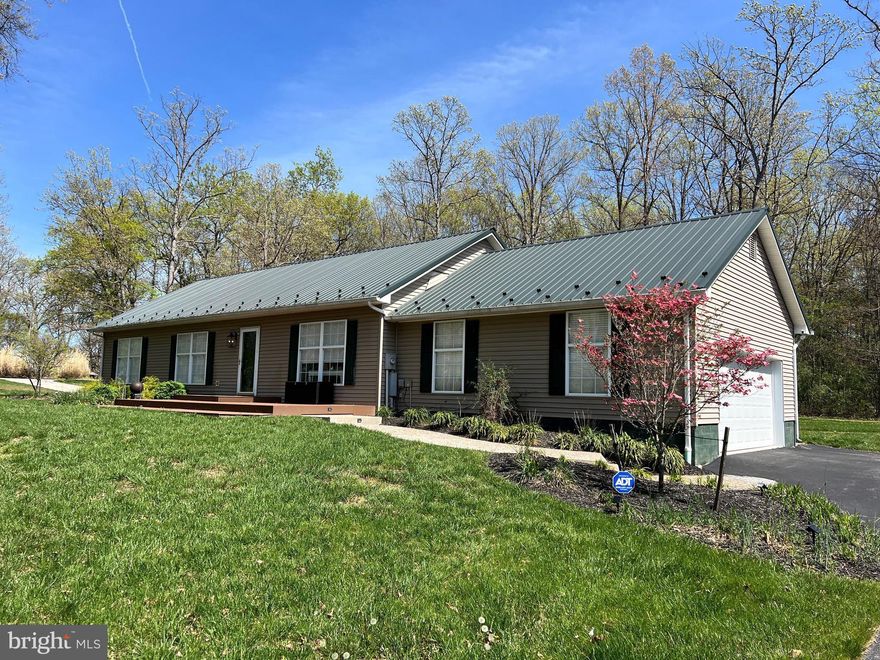 Turnkey, this home is ready to move in to! Beautifully appointed, this repetitive roofed rancher will take your breath away when you walk through the door! Built in 1995, it was totally rehabbed in last couple of years from floor to ceiling, inside and out, and it it is ready for enjoying the country life at the edge of town! With three bedrooms, two baths and spacious decks off front and back including a hot tub and large sitting area,  you will feel immediate comfort. An open concept living, kitchen and dining area with beautiful graduated granite counter tops adorns the entry. The master bedroom boasts lots of light with a walk in closet and  a master bath with garden tub. Beautiful flooring and granite counter tops mesh with the pristine white walls throughout. On the other end of house, you'll find two bedrooms and a bath that leads to the heated garage with pull down stairs for plenty of storage. Additional storage available in the barn/shed. Pebbled concrete walkways off front and back decks lead to the paved driveway, which is flat and has a convenient RV pad with full hook-up of electric, gas and sewer for your motor home! Five minutes from Moorefield town center means a short distance to shopping for essentials, parks, restaurants and health care!  One level living makes this the perfect retirement home! Remember, good things come in small packages! Buyer must have pre-qualification letter from lender.