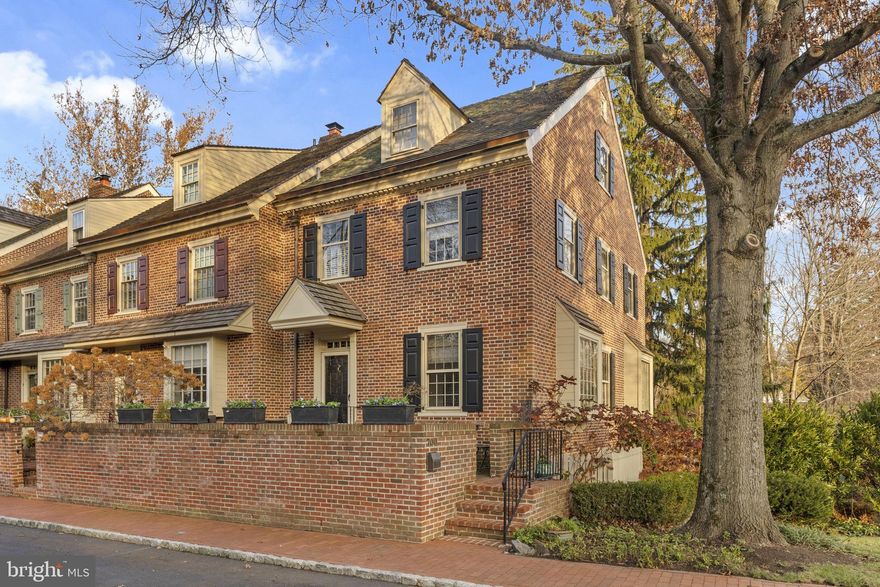 Discover 700 Willowmere Lane, a truly remarkable 3-bedroom, 4-full-bath end-unit carriage home tucked within one of Willowmere’s most picturesque settings! This beautifully maintained residence offers three finished levels and a seamless blend of sophistication, comfort, and thoughtful updates both inside and out.

Enter through a private brick courtyard to a charming foyer with timeless black-and-white tile. The home features 9' ceilings and hardwood flooring on every level, offering an airy, cohesive feel throughout. The main floor is filled with natural light and features elegant millwork, expansive windows, and inviting spaces for everyday living and entertaining. The updated kitchen leaves a grand impression with its marble counters and backsplash, sparkling Viking stainless-steel appliances, a new dishwasher, abundant cabinetry topped with crown molding, recessed lighting and an adjoining breakfast area framed by a charming window seat.
The living room is both warm and impressive, showcasing custom built-ins, serene rear views, and the first of three wood-burning fireplaces. 

The second floor hosts a spacious Primary Suite complete with the second fireplace, generous closet space (3 total including one walk-in), crown molding, recessed lighting and an updated full bath with marble accents and a new vanity. A second bedroom sits nearby with its own beautifully modernized full bath. The third floor offers a charming additional bedroom with dormers, excellent storage (3 crawl spaces), and another private full bath with a spa-like stall shower highlighted by a gorgeous floor-to-ceiling marble tile shower.

The finished walkout lower level includes a slate-floored family room with custom seating, a third fireplace, a full bath, and a large laundry room, along with access to the tranquil brick patio overlooking the wooded backdrop and stream. Its private bath and separate outdoor access make it an ideal guest suite option.

Recent improvements bring peace of mind, including a cedar roof (2020), newer mechanicals, fresh exterior carpentry and paint (2023), updated shutters (2023), water heater (2024), dishwasher (2024), washer/dryer (2023), and repointing and stucco work on the front patio (2019). Interior enhancements such as wainscoting, fresh paint, updated decor, and custom window treatments add an elevated, move-in-ready feel throughout.

A detached 1-car garage completes the property. Ideally located just minutes from downtown Ambler, the train, major roadways, and Whole Foods, and situated within the highly regarded Upper Dublin School District! A rare opportunity to own a beautifully updated home in one of Willowmere’s most desirable locations! Schedule your private showing today!