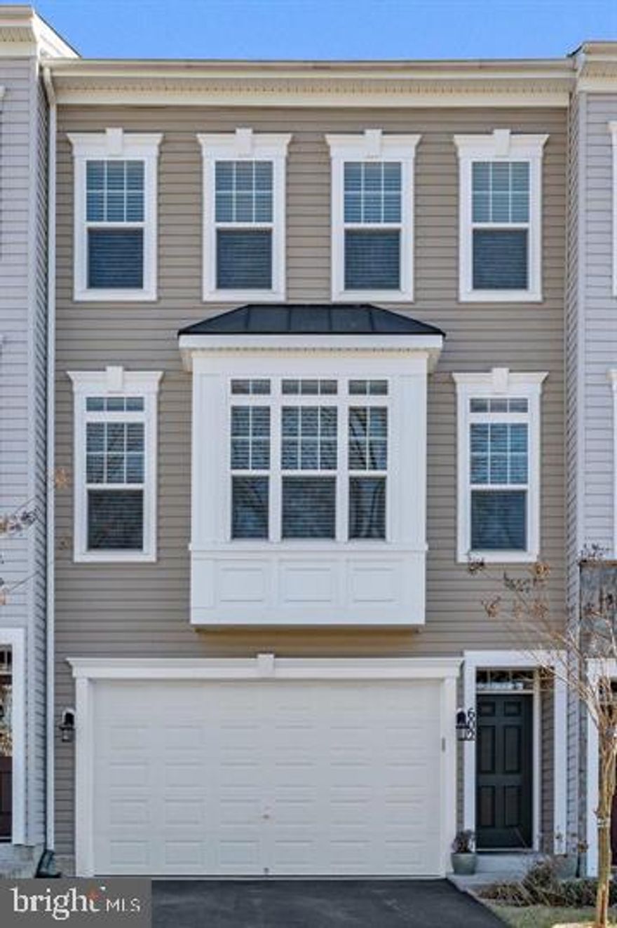Welcome home to 602 Savile Row Terrace, a stunning luxury townhome perfectly situated in Purcellville’s desirable Mayfair community. Boasting 2,664 finished square feet of premium living space across three levels, this meticulously maintained residence combines high-end builder upgrades with brand-new 2026 updates, including a new microwave and fresh paint throughout over half the home, along with a new 2025 dishwasher. Stay connected with ease, as this home comes fully equipped with Xfinity High-Speed Internet, perfect for seamless remote work, gaming, and streaming.
The heart of the home is the expansive main level, featuring an airy open floor plan highlighted by hardwood floors, craftsman-style board and batten trim, and soaring floor-to-ceiling windows. The gourmet kitchen is a chef's dream, complete with quartz countertops, a matching backsplash, and custom wood soft-close cabinets with pull-out drawers. Enjoy morning coffee in the sunroom or step out through glass sliding doors to the oversized, maintenance-free Trex deck—perfect for entertaining against a backdrop of peaceful wooded views.
Retreat to the upper level, where convenience meets luxury. The primary suite serves as a true sanctuary, featuring two spacious walk-in closets and a spa-like ensuite bathroom with a soaking tub, double vanities, and a private water closet. This level also includes two additional guest bedrooms and a dedicated laundry room with front-loading appliances.
The fully finished walk-out lower level offers a versatile recreation room that can easily be adapted as a fourth bedroom, complete with a third full bathroom and direct access to the fenced rear yard and concrete patio.
Tucked away near the end of a quiet street with no through traffic, this home is ideally positioned to offer mountain and pond views from the front and privacy in the back. Residents enjoy easy access to extended visitor parking and premier community amenities, including basketball courts, walking paths, and a stone pavilion with a BBQ area. Located just minutes from historic downtown Purcellville, the W&OD trail, and Loudoun’s famous wine country, this move-in-ready gem offers an effortless commute to Dulles Airport and DC. Immediate delivery available—don't miss your chance!