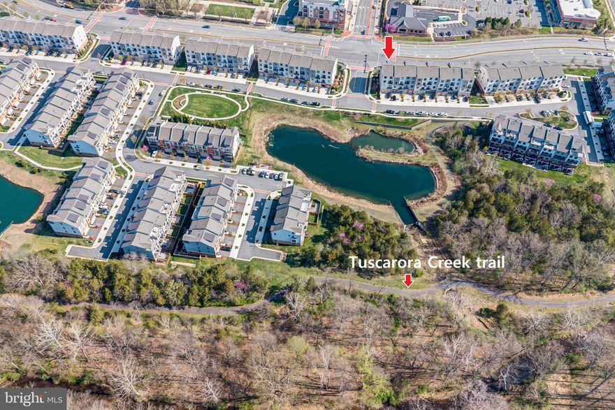 Welcome to this modern 3-bedroom, 2.5-bath townhouse style condo. This property is about  2,674 sq ft of bright living space with contemporary finishes, balconies, and an attached garage. Prime walkable location right next to a vibrant mixed-use area with shops, restaurants, and entertainment. Outdoor enthusiasts will especially appreciate being only moments away from the W&OD Trail, perfect for walking, biking, and enjoying the fresh air, along with additional nearby parks and paths. Convenient access via the Dulles Greenway, Route 7, and Route 15 for easy commutes. Washington Dulles Airport is a short drive away, with nearby bus options and Leesburg Executive Airport. This property delivers the perfect blend of modern condo living and community convenience.
