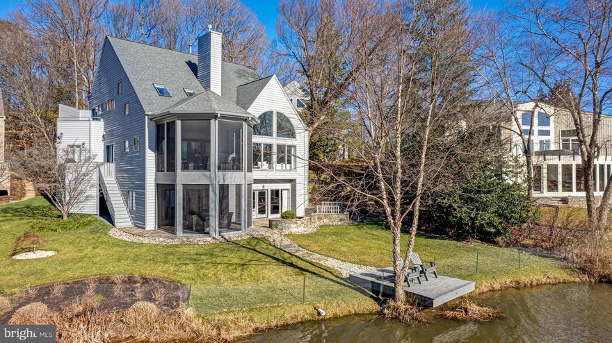 Perched on a tranquil cul-de-sac, overlooking the breathtaking expanse of Lake Newport, this modern masterpiece has undergone extensive renovation.  This exciting contemporary is bathed in natural light cascading through oversized windows and skylights accentuating the picturesque views of the serene lake.   
Step inside to discover a meticulously redesigned interior adorned with high-end finishes and impeccable craftsmanship, where not a single detail has been overlooked.  The main level welcomes you with soaring ceilings and an open layout, seamlessly connecting the living space.  A chef’s dream, the renovated kitchen showcases top-of-the-line appliances including: Sub Zero, Bosch and Thermador, and complemented by sleek cabinetry and luxurious quartz counters, offering both style and functionality.
Entertaining is a delight, whether hosting gatherings in the spacious living area or stepping out onto the rebuilt 2 level covered screened porches and private patio, where southern exposure bathes the outdoor spaces in warmth and sunlight. Infrared heaters on both levels allow you to enjoy the outdoor vistas in all seasons.
The upper-level retreat features four generously sized bedrooms.  The owner’s suite offers a serene sanctuary, complete with views of the lake from the balcony and a spa-like bathroom.   Additionally, there is an ensuite bedroom with cathedral ceilings and 2 bedrooms with a shared buddy bathroom.
Venture downstairs to the walk-out lower level, where endless entertainment options await.  Direct access to the private dock allows for seamless water activities, while the wet bar and entertainment room provide the perfect setting for gatherings with friends and family.  A versatile den/flex room completes this exceptional space.  Welcome to your lakeside sanctuary!
