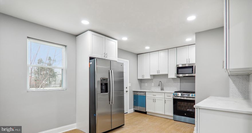 Beautiful and ready to go.   Single Family brick home in sought after Lewisdale subdivision.  3 fully finished levels featuring 4 bedrooms, 2 full bathrooms, New kitchen cabinets, New Appliances, New quartz counters, New flooring, New fixtures, the list goes on.  The fully finished basement features a bedroom, a bathroom, and plenty more living space.   The rear deck and fenced in yard create great space to entertain.  You won't be disappointed with this one.  Call helpful agent with questions or to schedule your viewing today.