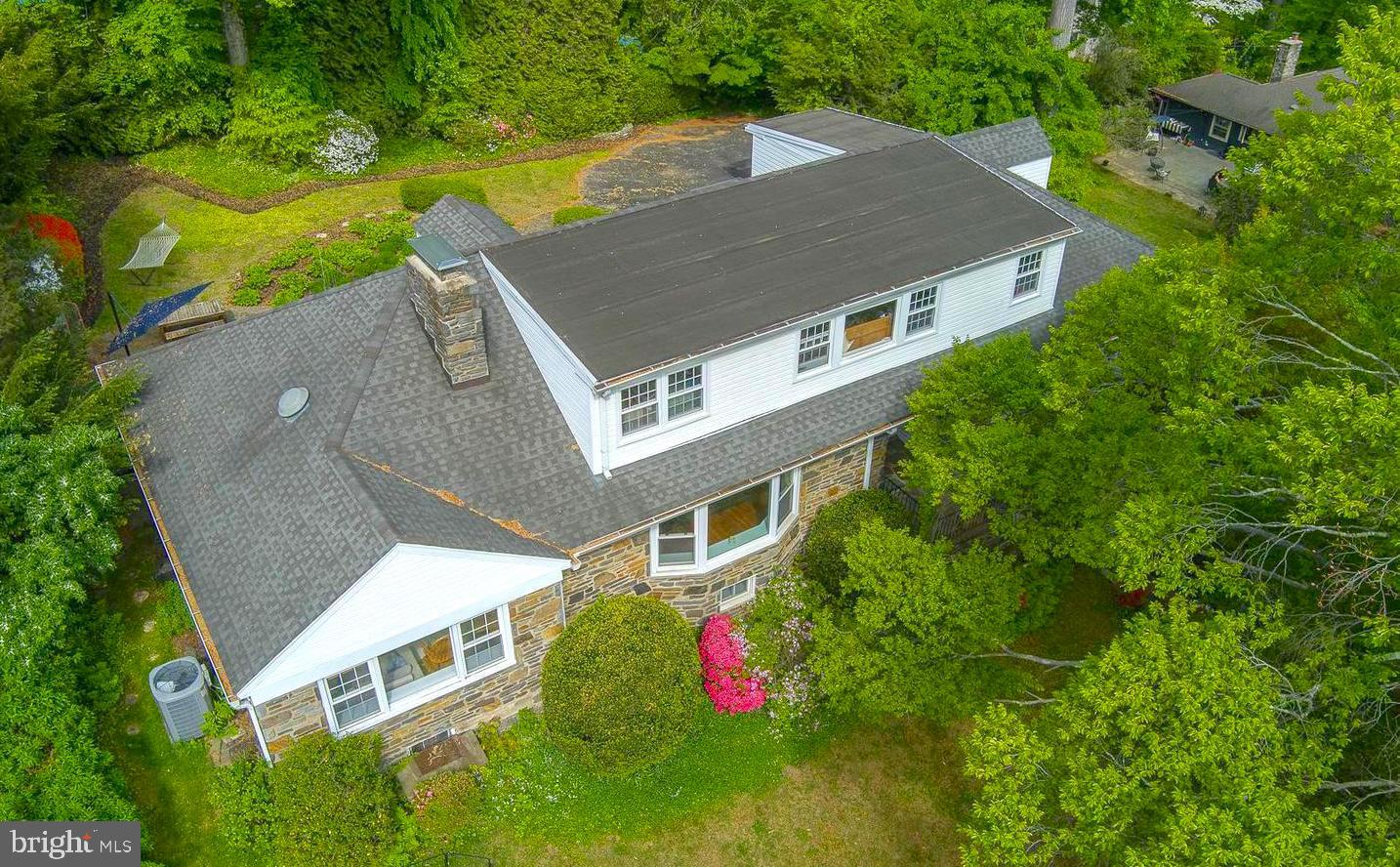 This 5,070 SQFT, 4 Bed/4.5 Bath Stone Cape, perched up from the road for privacy, has one of the most expansive living spaces in Lower Merion Township UNDER $1M dollars. From the moment you step inside, you'll be impressed by large room sizes and thoughtful layout. The open floor plan, enhanced by large windows, bathes the interior in natural light and effortlessly merges indoor and outdoor living.
From the Foyer, you'll enter the inviting Living Room featuring a bow window, gleaming hardwood floors, and recessed lighting, creating a warm and welcoming atmosphere. The formal Dining Room seamlessly connects to the Eat-in Kitchen, which is equipped with modern stainless steel appliances, including two double ovens (one convection), a 5-burner cooktop, a refrigerator, and a built-in microwave. The Kitchen is beautifully appointed with granite countertops, a stylish backsplash, a walk-in pantry, and ample cabinetry. A convenient door off the kitchen provides easy access to the backyard.
The Family Room boasts a stunning stone fireplace, hardwood floors, and a dry bar with upper and lower cabinets. It opens to a partially covered stone patio, perfect for entertaining or relaxing. Additionally, it offers the potential to create an additional main-floor bedroom suite.
The first-floor Primary EnSuite offers a tranquil retreat with a spacious bedroom featuring ceiling fans, an armoire, a walk-in closet, and French doors leading to a private office. The luxurious en-suite bath includes a jetted tub, a glass-block tiled shower, and a large vanity for your comfort.
Upstairs, you'll find three generously sized bedrooms, one with an en-suite bath, and all with large closets. An additional full hall bathroom completes this level. The expansive finished basement adds incredible versatility, ideal for a gym, media room, playroom, craft space, or whatever suits your lifestyle. It also includes three large storage rooms, a laundry room, and outdoor access.
Additional highlights of this home include an oversized 1-car garage, expansive parking, and a private backyard with a patio. Nestled in an ideal location, this property is within walking distance to award-winning Lower Merion Schools and a few minutes to highway for easy commute to Center City Philadelphia. Don't miss out on this must-see home!