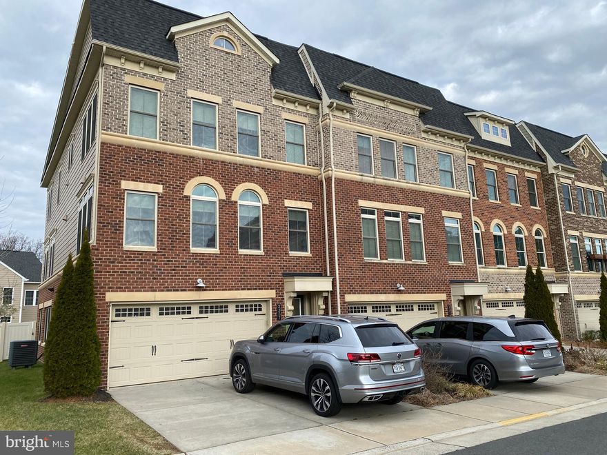 *JUST LISTED & Open Sun 1-4PM* Luxury end unit townhouse with 3200 finished square feet on three levels to include 4 beds, 3.5 baths, a walkout lower level, and fenced rear yard. Sun drenched and "like new", this stunning modern upgraded home was built in 2016 by NV Homes and features an open main level with high end kitchen to include modern cabinets, quartz counters, a large kitchen island that sits 5 comfortably, a walk-in pantry and open to the family room with gas fireplace and connects to the expansive deck where you have plenty of space to dine and relax. Also on the main level is a separate dining room, large enough to seat 8-10 dinner guests, a half bath, coat closet and features hard wood floors, modern lighting, custom window treatments and beautiful moldings. On the upper level houses the luxury primary suite with two walk-in closets, sitting area, hard wood floors, window treatments, and primary bathroom with double sinks, quartz counters, modern lighting, and large glass front shower with double shower heads. Other features on the upper floor are two additional secondary bedrooms with large built-in closets, comfy carpet,  custom window treatments, a hall bath with double sinks, and a spacious laundry room. The lower level (entry level) has the 4th large bedroom with walk-in closet, full bath, bright and light walk out rec room with access to the fence backyard, patio,  play ground and oversized two car garage. Ideally located off rte 7, close to West Falls Church Metro, Falls Church City downtown shops and restaurants, Whole Foods, Trader Joes and WO&D Trail.