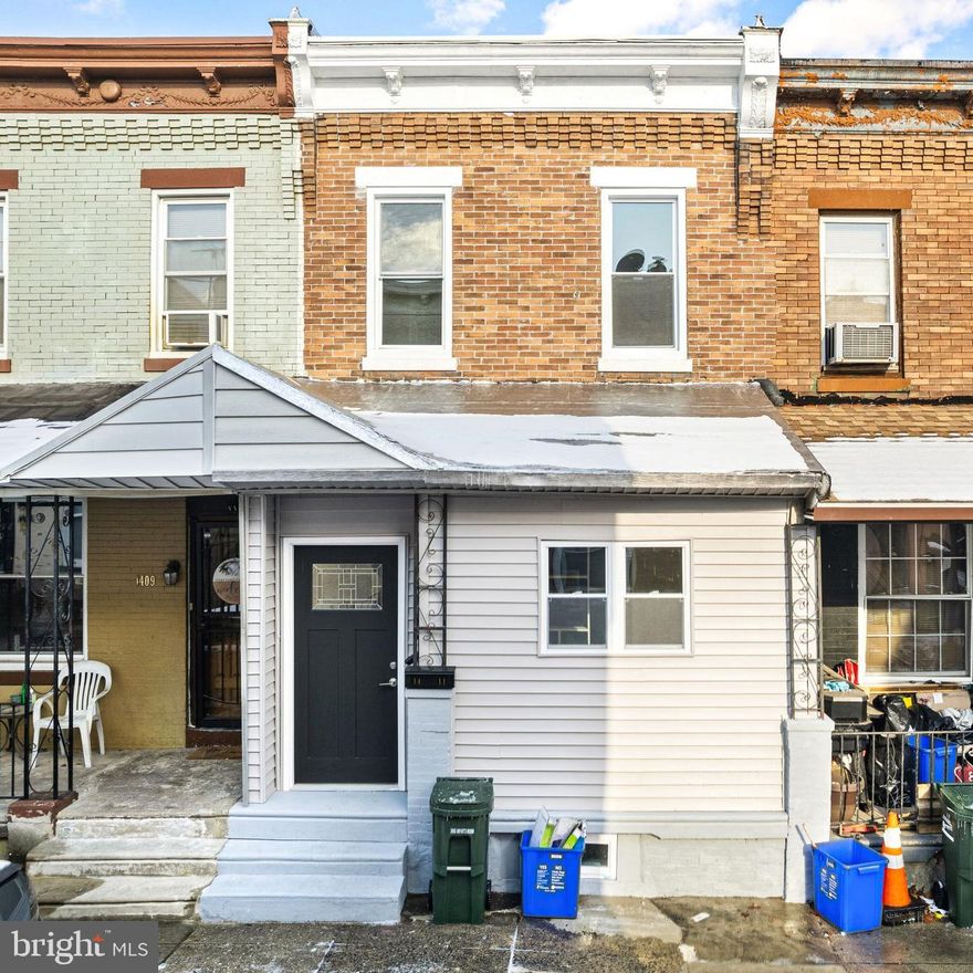 ***HOME QUALIFIES FOR GRANTS & NO PMI for buyer that qualify ***Welcome to 1411 S Paxon Street, a fully rehabbed gem in the high-demand neighborhood of Kingsessing Philly! Known for its rich history, strong community, and exciting growth, Kingsessing offers a prime location for first-time homebuyers or real estate investors seeking rental opportunities. This home has been thoughtfully updated with new central heating and air, a new roof, a brand-new deck, and stylish interior finishes. Step into the newly enclosed porch—ideal for a home office or mudroom setup—and enjoy the open-concept design of the spacious living and dining areas. The interior showcases wide plank hardwood floors, fresh paint, and a stunning new kitchen featuring white shaker cabinets, granite countertops with gray flecks, matte black hardware, and a modern tile backsplash with a black accent stripe. Beyond the kitchen, the new Trex deck provides the perfect space for year-round grilling and outdoor entertaining. One of the home’s standout features is the sleek black metal railings leading to the second floor, where you'll find two inviting bedrooms and a beautifully updated full bathroom. The fully finished basement adds versatility, offering space for a third bedroom, office, or media room. It also includes a second full bathroom and a new Samsung washer and dryer. Situated in a Walk Score 85 and Transit Score 81 area, this home is conveniently located near Woodland Avenue, several bus and trolley lines, and offers quick access to University City, Drexel University, USciences, local parks, and the highly regarded Independence Charter School West. *For eligible buyers, the home qualifies for BANK GRANTS and no PMI mortgage programs, making it an even smarter investment.* Don’t miss this opportunity to own a stylishly updated home in a high-traffic, rapidly appreciating area.