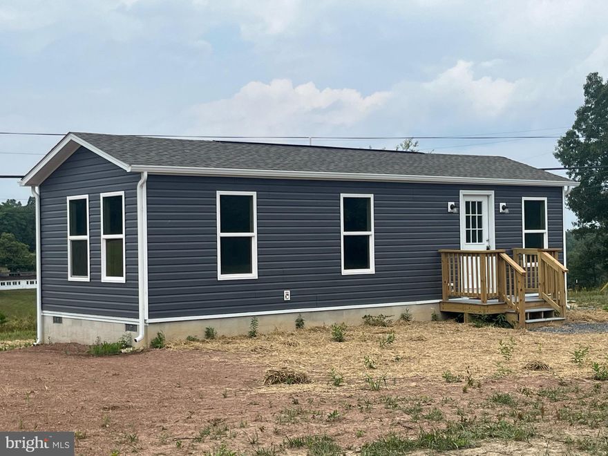 Brand new compact home on 1.4 acres ! This new ranch style home features 1 BR, 1 bath and would be perfect for those starting out or starting over! Just minutes from historic Berkeley Springs, would be a great weekend getaway or AirBnb.   Enjoy peaceful pastoral views from the rear deck. There is a 3 BR conventional septic system, so expansion is possible.  Conveniently located for easy commute to I-70, Martinsburg & more!