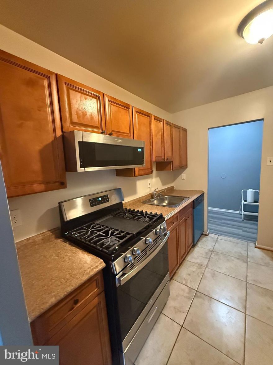 Top floor 2 bed 2 full bath with den. All utilities included in the condo fee. Well maintained unit featuring updated kitchen, separate dining and living room. Spacious Primary bedroom with a large walk-in closet. Washer/Dryer in unit. Freshly painted and ready to move in. Two parking spaces. Great location close to restaurants, shops, and public transportation. Enjoy the amenities community pool, kids playground, and more.