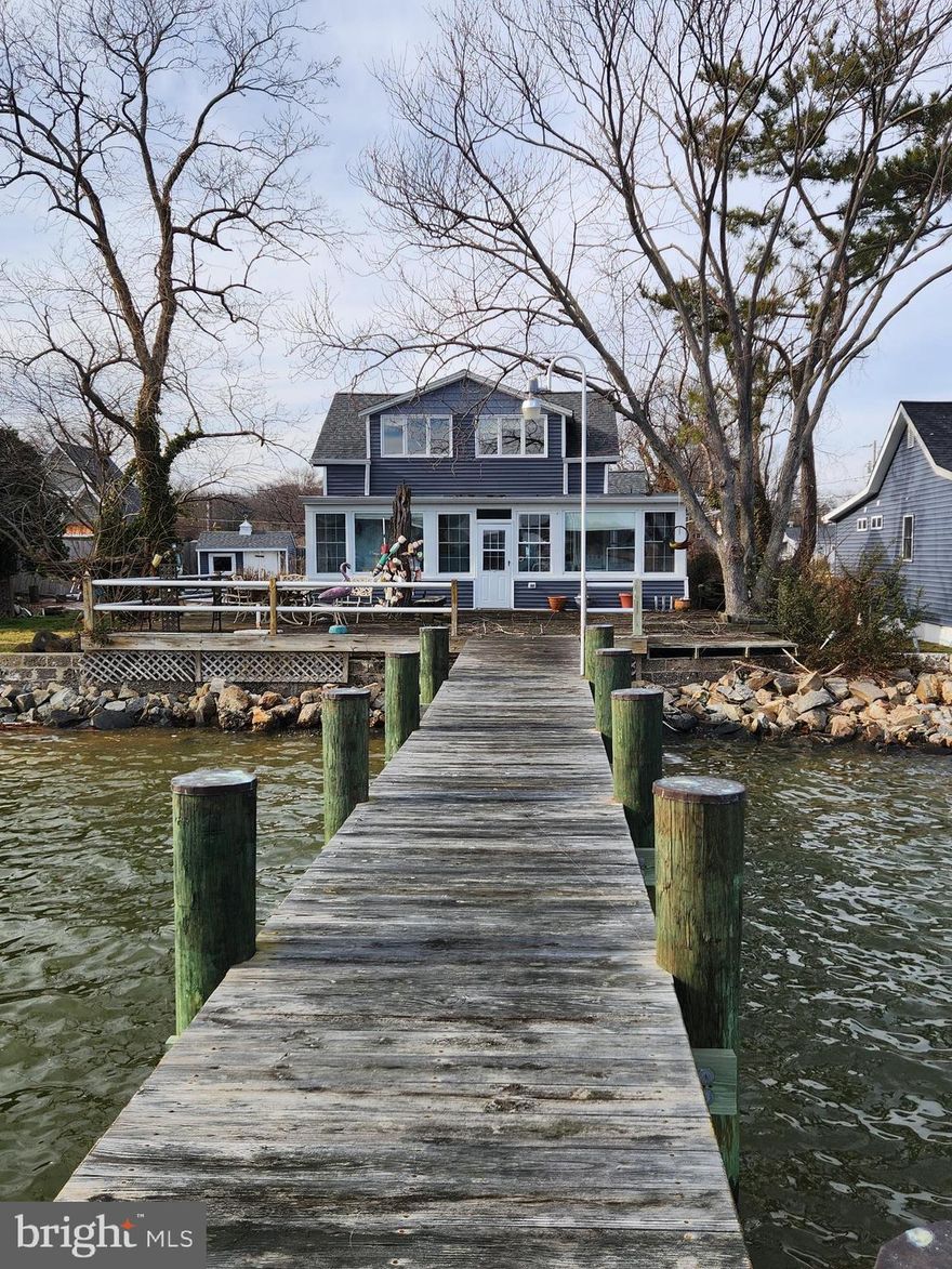 This home is a very rare find in our area. Home is a true diamond in the rough. Home is in the need of a rehab and some T.L.C. from its new owner. Breathtaking views located on the mouth of Bodkin Creek. Home offers deep water, large pier, inground pool, private sandy beach area, four bedrooms, two baths, double lot, detached garage and more. Home has had some updates over the years, including, roof, siding, windows, well and more. This home can easily be transformed into your dream home, perfect for year around enjoyment with plenty of room for entertaining. Home is being sold as-is and seller will accept Cash or Rehab Conventional loan.