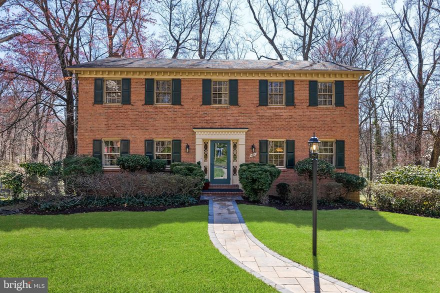 Welcome to 1631 Courtland Road, a stately brick Colonial sited on a rare double lot (.88 acres) backing to serene woodlands.  This classic 4-bedroom, 2.5-bathroom residence offers the perfect blend of timeless elegance and modern sophistication.  A curated, beautifully designed rear addition by a renowned local architect floods the house with natural light through a stunning wall of windows.  A huge rear deck overlooking the wooded double lot offers seamless and flowing entertaining options. 
Step inside to discover a classic foyer, abundant gorgeous custom millwork, and gleaming hardwoods. The oversized chef’s kitchen features custom cherry cabinetry, a Sub-Zero refrigerator, a Blue Star range, granite countertops, a huge island with storage, and an inviting breakfast nook nestled by a custom bay window.  Enjoy a screen-in porch directly off the kitchen that conveniently accesses the rear deck.
Additional main living level highlights include a formal living room with a woodburning fireplace, custom built-ins, a formal dining room and a cozy family room which would work beautifully as a home office or main level bedroom.  There is a convenient powder room on this level as well. 
The bedroom level highlights included a private primary suite, a true retreat, boasting a woodburning fireplace, spa-inspired bathroom featuring double vanities, a gorgeous soaking tub, a walk-in shower with custom tiling, radiant floor heating and beautiful architectural lighting encased by whimsical woodwork.  The primary suite boasts striking custom windows that flood the space with natural light and a walk-in closet.  There are three additional amply sized bedrooms on this level and a full hall updated bathroom.
The lower level is accessed through both the 2-car garage and French doors from the outside.  There is a lovely family room and another woodburning fireplace encased in brick.  There is also an updated laundry room on this level.  
Car enthusiasts and hobbyists will love the 2-car garage plus a separate workshop with ample storage.  This home is zoned for Waynewood Elementary School.
Located in the sought-after Waynewood Elementary School district, Courtland Road is a vibrant community with wonderful neighbors and an amazing location. Close to schools, library, seasonal Famer’s market, shopping, restaurants, and all commuter routes. 
The close by Potomac River beckons you to explore its scenic bike and walking trail along the George Washington Memorial Parkway. If you're an outdoor enthusiast who loves running, biking, or simply being in nature while staying close to the city, this home is close to all. Enjoy a lovely commute to Old Town, the District, Fort Belvoir, and the Pentagon, or opt for eco-friendly alternatives like biking along the picturesque George Washington Parkway or utilizing the convenient Metro Bus service to the Huntington Metro, providing carless commuting options to Old Town and downtown DC.
With unmistakable pride of ownership, this property is not just a house; it's a welcoming retreat. Embrace the lifestyle you've been dreaming of—welcome home!