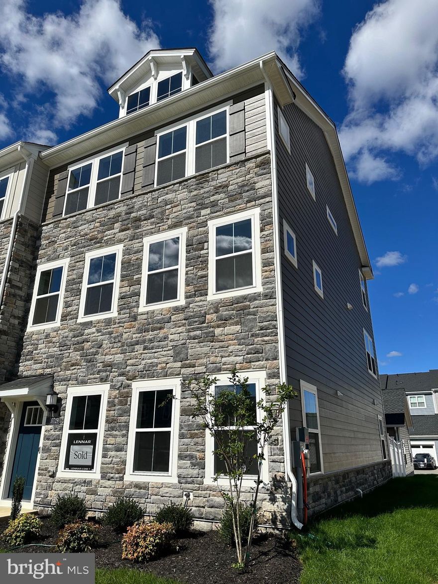 Welcome Home to the Ellicott Townhome with Detached 2-Car Garage St Charles - Highlands White Plains MD

Designed with both family living and entertaining in mind, this beautifully crafted three-story townhome offers space, style, and functionality in every corner.

The striking stone exterior adds a touch of modern charm, while inside, the first floor welcomes you with a flex space and recreation room with access to the backyard—perfect for play, guests, or a home office.

Upstairs, the open-concept main level features a spacious family room, gourmet kitchen with a stainless steel French door refrigerator, cooktop, double wall oven, dishwasher, and microwave, plus crown moulding and elegant finishes throughout. Wide plank flooring runs throughout the lower and main levels for a sleek, cohesive look.

Enjoy the convenience of a detached two-car garage, plus additional driveway parking for two more vehicles.

The third floor is home to all three bedrooms, including a primary suite with crown moulding, tray ceiling, a walk-in closet with natural light, private water closet, dual vanities, and a spa-inspired shower with built-in bench—your personal retreat after a long day.

Fun for the whole family starts in the heart of the home: the chef-inspired kitchen makes meal prep a joy, while the spacious bedrooms and smart layout offer room for everyone to relax and recharge.

Note: This home is scheduled for completion November 2025! Pricing and features are subject to change. Model photos shown for illustration purposes only.

Schedule your private tour today or visit us during our Weekend Open House hours to explore the model in person