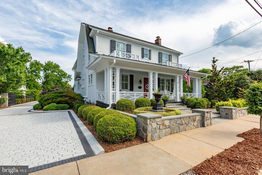 Nestled on a spacious .34-acre lot, this exquisite home offers unparalleled space and convenience in the heart of downtown Fredericksburg. The meticulously designed private rear yard boasts stunning hardscaping, featuring an outdoor kitchen, fireplace, multiple seating areas, and a large, lush lawn—ideal for entertaining and relaxation.

The gated driveway leads you back to the impressive 3-car drive-thru garage, wired for an electric car charging station and access from the rear alley. Above the garage is a separately metered fully renovated au-pair/in-law apartment featuring a full kitchen, bedroom, laundry, living room, and a cozy wood-burning fireplace.

Step inside the enchanting 1920s residence, where historic charm seamlessly blends with modern amenities. The chef's kitchen is a culinary dream, showcasing a Wolf gas range with double ovens, a Blue Star refrigerator, walk-in pantry, and a convenient breakfast nook. The main level also offers a formal dining room, living room, parlor, and a spacious mudroom. The centerpiece is the expansive light filled family room adjacent to the kitchen complete with wood-burning fireplace and built in bookcases.

Upstairs, discover 5 beautifully appointed bedrooms and 4 fully updated bathrooms. Every detail has been thoughtfully considered, including California closets in each of the bedrooms and a dedicated laundry room on the bedroom level with a relaxing infrared sauna. The primary suite features double walk-in closets, an oversized double shower, and custom stone and tile work. Hardwood floors and plantation shutters throughout the home add to its timeless elegance.

The lower level provides ample storage and a cozy den for family activities. With numerous upgrades and carefully crafted design elements, this extraordinary estate is a rare find within walking distance to all that downtown Fredericksburg has to offer. This home truly has it all!