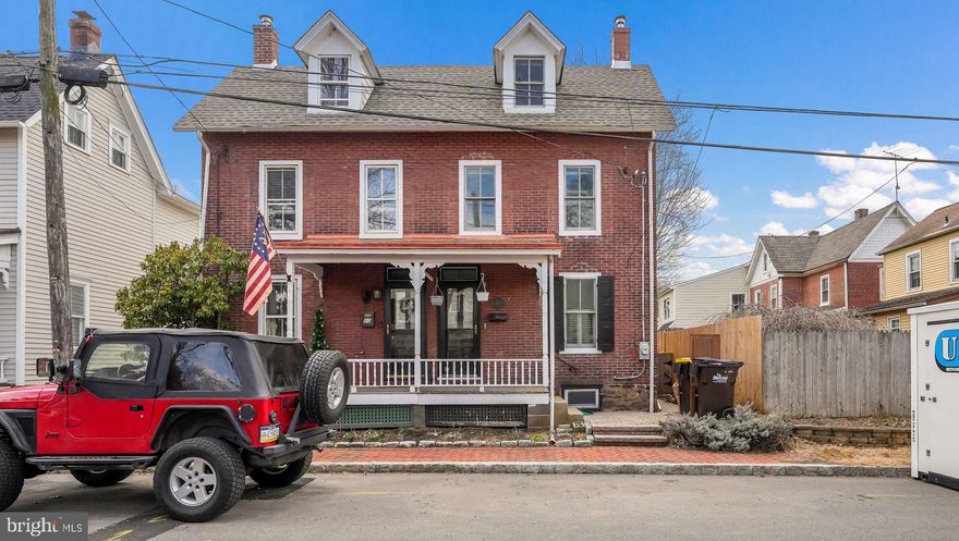 If you’ve ever dreamed of owning a historic home on a quiet, tree-lined street in beautiful Newtown Borough, this is the one. This red-brick gem has been thoughtfully renovated over the years, blending timeless character with modern updates.
Inside, you’ll find pumpkin pine floors, recessed lighting, and a spacious open floor plan designed for comfortable everyday living and easy entertaining. The fabulous kitchen features cherry cabinetry, granite countertops, stainless steel appliances, and a breakfast bar. French doors open to a fenced backyard with a pergola, creating the perfect outdoor retreat.
Upstairs, the primary suite offers a dramatic 12 foot vaulted ceiling, a walk-in closet, and an updated en-suite bath. A second bedroom with two closets, a hall bath, and conveniently located upstairs laundry complete the second floor. The third floor loft bedroom is quaint, cozy, and full of charm.
Set in the heart of Bucks County, this home is just a short walk to downtown Newtown’s coffee shops, restaurants, shopping, library, and parks. With easy access to Route 95 for commuting to Center City, New Jersey, and New York, the location is as convenient as it is picturesque.
Move right in and enjoy historic charm, modern comfort, and an unbeatable Borough lifestyle.