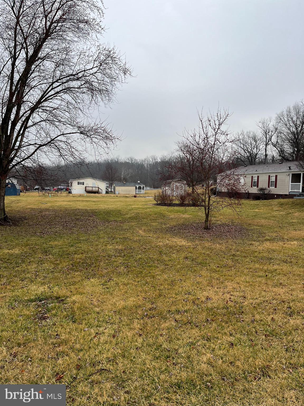 This is one special lot for a doublewide to make its home on. No lot fee or HOA. Plenty of room for a garage also along with a play area for your children. You will not find a more private mobile home park that has space between the homes. This is a must-see. Don't let this one pass you by. Spring Mills schools. Close to schools, shopping, I-81, and many conveniences. This community has a community septic which this property already has a 1000 gallon tank on the property, which would still need a 500 gallon tank placed on the property. This also has public water line run for the property.