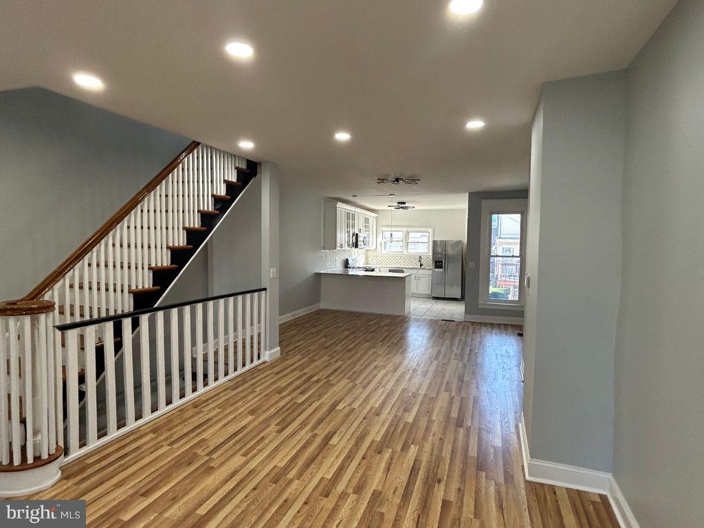 Discover modern luxury at 5718 Florence Ave, a newly renovated, sunlit 4-bedroom, 2-bath town-home in the heart of Kingsessing. As you enter, you’re greeted by a spacious foyer leading to an open-concept living and dining area adorned with elegant lighting, setting the tone for sophisticated living.
The chef-inspired kitchen is a standout, featuring stunning marble countertops, top-of-the-line stainless steel appliances, and sleek cabinetry with plenty of storage. Upstairs, three spacious bedrooms provide comfort and versatility, accompanied by a chic hall bathroom. The primary bedroom at the front of the home offers a serene retreat with ample closet space.
The fully finished basement expands your living options—perfect for a home office, entertainment area, or gym. The basement bathroom boasts a frame-less glass shower and matte black fixtures, creating a spa-like ambiance.Step outside to enjoy a beautifully paved, private fenced yard, ideal for relaxing, entertaining, or gardening. With modern upgrades like a new central air system, an energy-efficient 50-gallon water heater, and resealed roofing, this home blends style and reliability. 5718 Florence Ave is the perfect combination of charm, comfort, and contemporary living—ready to welcome you home!