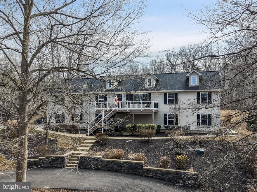 COMING SOON – Private Country Estate on 25 Acres
Completely renovated and exceptionally private, this spacious colonial with rambler-style living appeal is set on a picturesque 25-acre farm, offering endless possibilities for multi-generational living, equestrian use, or a private retreat. The property includes a beautifully updated two-level barn ready to accommodate horses, if desired.
The main residence offers 5 bedrooms, 4.5 baths, and over 5,000 square feet of living space. The upper level features a custom kitchen, separate formal dining room, living room, and a large family room situated over the two-car garage, along with three bedrooms and 2.5 baths.
From the laundry area, access leads to two distinct living options. One staircase connects to the two-car garage and a private bonus suite, ideal as an au pair or guest ensuite, complete with its own living space and full bath. The opposite side of the lower level offers a separate side entrance with a family room, full-size kitchen, large bedroom, and full bath—perfect for extended family or independent living.  A dedicated parking area is conveniently located near this entrance. Dual composite decking has been added to front and back entrances.  
The property features a wraparound driveway, expansive open land, and a large two-level barn equipped with five horse stalls, tack room, full water access, spigots, and an independent electric meter.  The upper level on the barn can be transformed or outfitted for living accommodations, entertainment or storage. 
 Electric fence poles are already in place, with power easily operable from the barn once livestock or horses are added. The land has been surveyed and clearly marked, and a natural creek runs through the property, enhancing its serene setting.  Surrounded by Amish farmland, this estate offers unparalleled privacy, Rural serenity and charm, while still providing modern updates and flexible living arrangements.