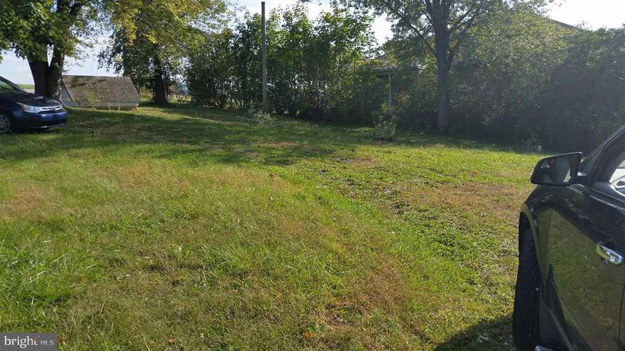 Nice 1/2 acre lot with well and public sewer.  You can put another trailer on it or build your own house.  New well in 2011.