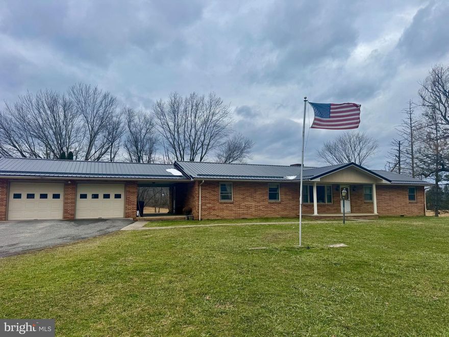 Inviting ranch-style brick home, perfectly positioned on 1 +/- acre along the scenic Tygart Valley River. Spanning 1,904 sq ft, this spacious home features 3 cozy bedrooms and 2.5 baths, offering ample room for you and guests. Ideal for outdoor gatherings, gardening, or simply enjoying the serene sounds of the river. The attached 2-car garage ensures convenience and protection for your vehicles. Along with a detached storage garage. Step inside to find a welcoming living area with a charming fireplace, perfect for cozy evenings. Brand new metal roof. This property offers the perfect blend of comfort, nature, and convenience, making it a must-see for those seeking tranquility with easy access to Elkins & Historic Beverly. Don't miss your chance to call this gem home right on route 219. This 1 +/- acre lot is pending seller survey. Is part of a 4.22 +/- acre larger parcel. Lot lines are approximate.