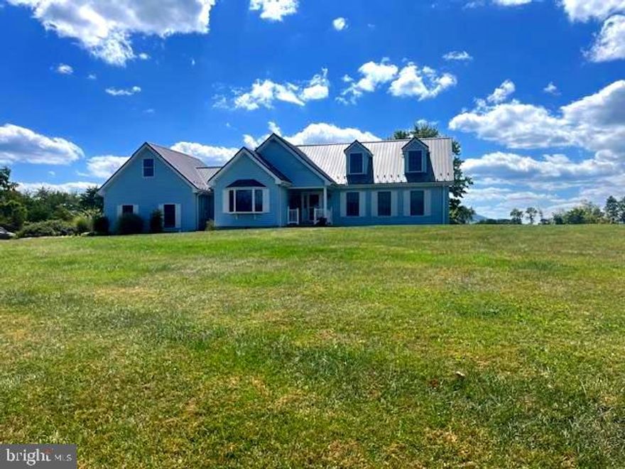 PEACEFUL SETTING ON 11.61 UNRESTRICTED ACRES! THE PROPERTY CAN BE DIVIDED, IF DESIRED.  THE SPACIOUS 3,268 SQ FT HOME WAS BUILT IN 1993.  THE COUNTRY KITCHEN COMES WITH NEWER APPLIANCES, SOLID HARDWOOD CABINTRY, EXPANSIVE COUNTERTOPS AND CERAMIC TILE.  OFF FROM THE KITCHEN IS THE BREAKFAST AREA, CONVENIENT FOR A QUICK MEAL.  THE SEPARATE DINING ROOM HAS HARDWOOD FLOORS AND CAN SEAT A LARGE PARTY FOR THE HOLIDAYS, OR ACCOMODATE A GROWING FAMILY.  ON THE MAIN LEVEL IS A SIZABLE BEDROOM WITH AN ATTACHED BATHROOM, WITH A JETTED TUB AND SHOWER AND PLENTY OF CLOSET SPACE. ON THE 2ND FLOOR ARE 2 ADDITIONAL BEDROOMS WITH A FULL BATHROOM. IN ADDITION, IS THE PULL-DOWN ATTIC STEPS WITH PLENTY OF DRY STOREAGE.    THE OPEN-FACED BARN WAS USED FOR THE HORSES THEY PREVIOUSLY ENJOYED.  THERE'S AT LEAST 5 ACRES FOR MAKING HAY.  OFF TO THE LEFT OF THE PROPERTY IS A SECTION OF WOODS WITH A STREAM WHICH FEEDS INTO THE SPRING-FED POND FOR CATTLE OR HORSES.  HUNTING IS ANOTHER, OPTION, ON YOUR OWN LAND. THE OWNERS HARVESTED THE HAY FOR HORSES AND CATTLE, INCLUDING RAISING CHICKENS AND GATHERING EGGS.  THE BACK OF THE HOME HAS A BEAUTIFUL SETTING FOR THE GAZEBO AND A GOLDFISH POND.  WELL & SEPTIC.  THE PROPERTY IS OFF OF RT 50 THEN OFF OF RT 29N TO MILLER LANE TO THE BEAUTIFUL SETTING FOR THE HOME ON 11.61 UNRESTRICTED ACRES.