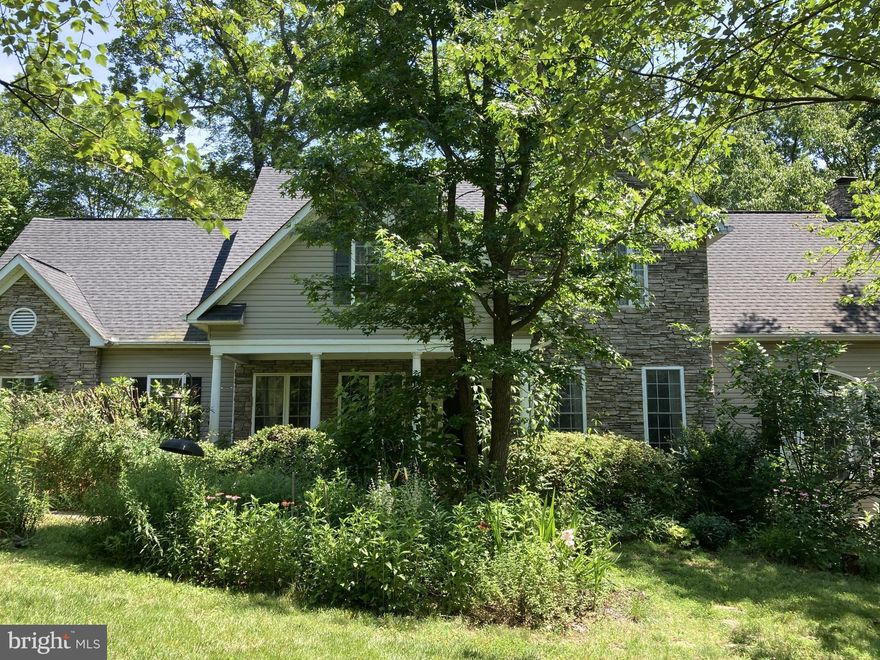 Location, Location, Location!
Ideally situated just minutes from shopping, medical facilities, grocery stores, restaurants, I-95, and Route 1—this home offers unbeatable convenience in a tranquil, nature-rich setting.
The entire yard is a certified Natural Habitat,  landscaped in an English garden style with a mix of native and ornamental plants designed to attract butterflies and birds—creating a peaceful, picturesque retreat on 1.6 acres.
Inside, you'll find 5 spacious bedrooms and 4.5 bathrooms across 4,487 square feet of thoughtfully designed living space. The primary suite is a true sanctuary, featuring double walk-in closets and a luxurious spa-style bathroom designed to spoil you.
The main level showcases gleaming hardwood floors, a sunken family room with soaring 11-foot ceilings, and an extended entertaining area that includes a screened-in porch and a deck just off the kitchen—perfect for indoor-outdoor living.
The chef-inspired kitchen features new granite countertops, stainless steel appliances, and a six-burner gas ILIVE stove that will be the envy of any culinary enthusiast.
Downstairs, the fully finished lower level offers a wet bar-equipped family room, a playroom, a private office or NTC bedroom, and a full bath with a relaxing walk in shower—ideal for multi-generational living or hosting guests. Speaking of hosting guest the tankless hot water heater makes the hot water replenishment instant and efficient.  The oversized 2 car garage offers an electric car charging station, suitable for any model of car.  With add' l driveway or street parking also available. Don't miss the opportunity to make this beauty your own.