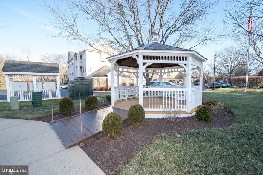 You won't be disappointed with beautiful 2 bedrooms, 2 full baths condo  in the desirable and rarely offered Holland Preserve 55 + community.   In this lovely unit you'll find a convenient entry hall with hardwood floors,  coat closet and large double door laundry closet with newer washer/dryer included as is.   The spacious living room has sliding glass doors to a good sized balcony overlooking  a  tranquil wooded area, a perfect spot to enjoy your morning coffee.  There is a formal dining room for your holiday meals or  where you can entertain your quests in style .   The kitchen has a brand new stainless steel gas stove and  built-in microwave and a brand new stainless steel dishwasher,  wood cabinets,  peninsula , double door pantry and a large eat-in area.   The oversized primary bedroom has multiple windows, ceiling fan and 2 walk-in closets. The huge attached primary bath has a double sink vanity, large stall shower with glass doors and a linen closet.   Bedroom 2 has a ceiling fan and large closet.  The hall bath has a vanity sink and tub/shower. Additional features:  One car attached garage with inside access; new HVAC;  storage/heater closet located on the balcony; convenient yet private location nestled off the beaten path but  close to shopping and  restaurants;  well appointed & secure  lobby entrance; elevator and so much more!!   Don't miss this opportunity to own this  beautiful, affordable condo and experience care-free living at it's best!!  Make your appointment today!!   ( A one time $150.00 assessment will be due 3/1/2024)