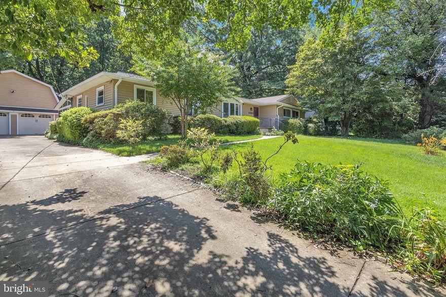 **Offers due by 6:00pm on Tuesday, July 25th** Amazing property! Lovingly maintained rambler has been beautifully updated and expanded. Three bedrooms and two full bathrooms on the main level - all are carpeted, with hardwood flooring under the carpeting. Updated kitchen with stainless steel appliances (gas range), Corian counters, 42" cabinetry, and LVP flooring is open to the family room addition. Living room with bay window (all windows in the home have been replaced), hardwood flooring and brick surround gas fireplace. Separate dining room with hardwood flooring overlooks the family room addition. Family room addition with vaulted ceiling, 3 skylights, hardwood flooring, wall of windows, raised area for dining adjacent to the kitchen. Huge work shop on the main level could be finished off for future living space but makes a great work shop! Screened porch with ceramic tile flooring, vaulted ceiling, recessed lighting and ceiling fan leads to the rear deck, backyard and garage. Lower level: Recreation room with brand new carpeting, brick surround wood burning fireplace, and recessed lighting. Fourth bedroom with egress window and LVP flooring, living room  (great in-law suite, au-pair suite, etc) as well as an updated full bathroom . Laundry/storage room with ceramic tile flooring. Detached 4 car garage with huge bonus room above has a lovely deck overlooking the backyard. The garage bonus room could be finished off for additional future living space, an amazing studio, guest apartment, etc.  Gas boiler 2009, A/C 2017, architectural shingle 2016 main roof, garage shingles 2022, electric heavy up 2007. Driveway fits approximately 8 cars! About 1 mile to the Wheaton Metro, as well as all of the wonderful restaurants, parks and shopping in Wheaton!