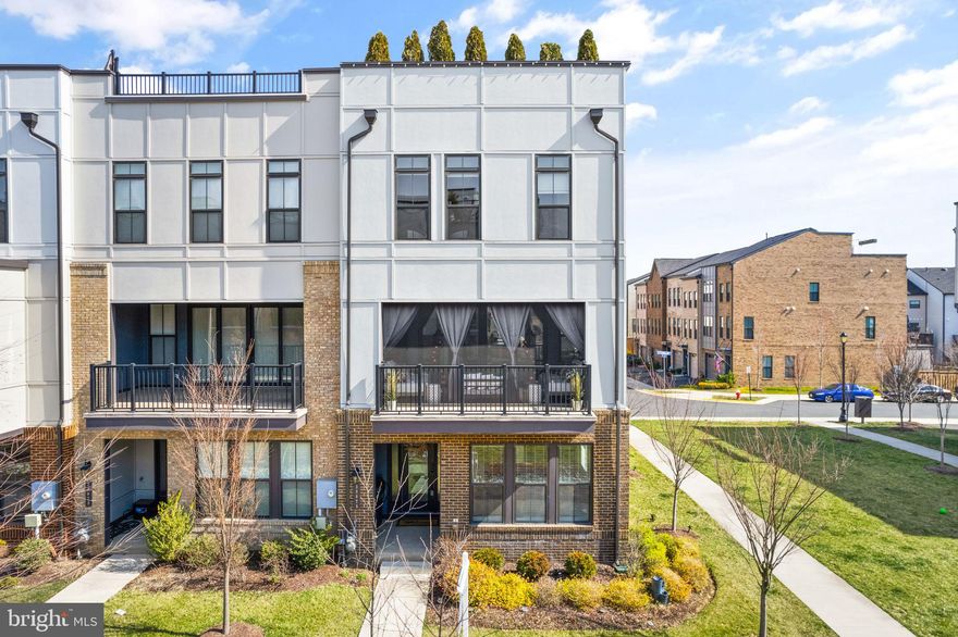 Welcome to luxurious living in the heart of Downtown Brambleton Garden District! This stunning end unit townhome offers the perfect blend of modern amenities and urban convenience. Boasting 3 spacious bedrooms and 4 elegant bathrooms, this home provides ample space for comfortable living.

Step inside and be greeted by an open-concept floor plan bathed in natural light, highlighting the contemporary design and high-end finishes throughout. The main level features a gourmet kitchen complete with stainless steel appliances, quartz countertops, and a large island, ideal for entertaining guests or enjoying casual meals with family.

Relax and unwind in the inviting living area, where large slider doors frame picturesque views of the surrounding neighborhood. Transition seamlessly to the outdoors through the front veranda, equipped with a power retracting screen for added comfort and privacy.

Ascend to the top level and discover the crown jewel of this home – a sprawling rooftop deck offering panoramic vistas of Downtown Brambleton. Whether you're hosting summer soirées or simply savoring a quiet evening under the stars, this expansive outdoor space is sure to impress.

Retreat to the spacious primary suite featuring a luxurious en-suite bathroom with his and her entrance and ample closet space. Two additional bedrooms provide versatility for guest accommodations or whatever your lifestyle demands.

Conveniently located within walking distance to shops, restaurants, parks, and more, this townhome offers the epitome of urban living. With easy access to major highways and public transportation, commuting to nearby cities is a breeze.

Don't miss out on the opportunity to call this exquisite townhome your own. Schedule your private tour today and experience luxury living at its finest in Downtown Brambleton Garden District!