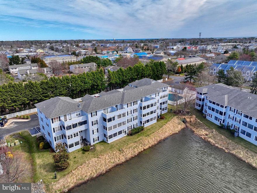 Home back on market due to no fault of the sellers or home. Welcome to 3808 Sanibel Circle located in Rehoboth Beach, DE — a bright coastal condo sold furnished with comfortable living, peaceful water views, and convenient access to the beach, shopping, dining, and everyday conveniences. This well-maintained condo features an open-concept floor plan with spacious living and dining areas, abundant natural light, and a seamless flow.
The clean, functional, and stylish kitchen has white cabinetry, ample counter space, and a breakfast bar that opens to the living area. The airy living room has direct access to a private screened porch overlooking the water.
Generously sized bedrooms and well-kept bathrooms create a relaxed beachside atmosphere. Soft coastal tones and natural light throughout the condo enhance the ambiance.
Sanibel Village, a part of the remarkable Eagles Landing community, offers residents access to three pools, tennis and pickleball courts, beautiful walking and biking paths, and ample parking. With close proximity to Rehoboth Beach and the Boardwalk, this condo offers easy access to shopping and incredible local restaurants such as Big Fish Grill, Eden and Thompson Island. Whether you’re seeking a primary residence, a vacation getaway, or an investment opportunity, this condo offers the ideal coastal lifestyle.