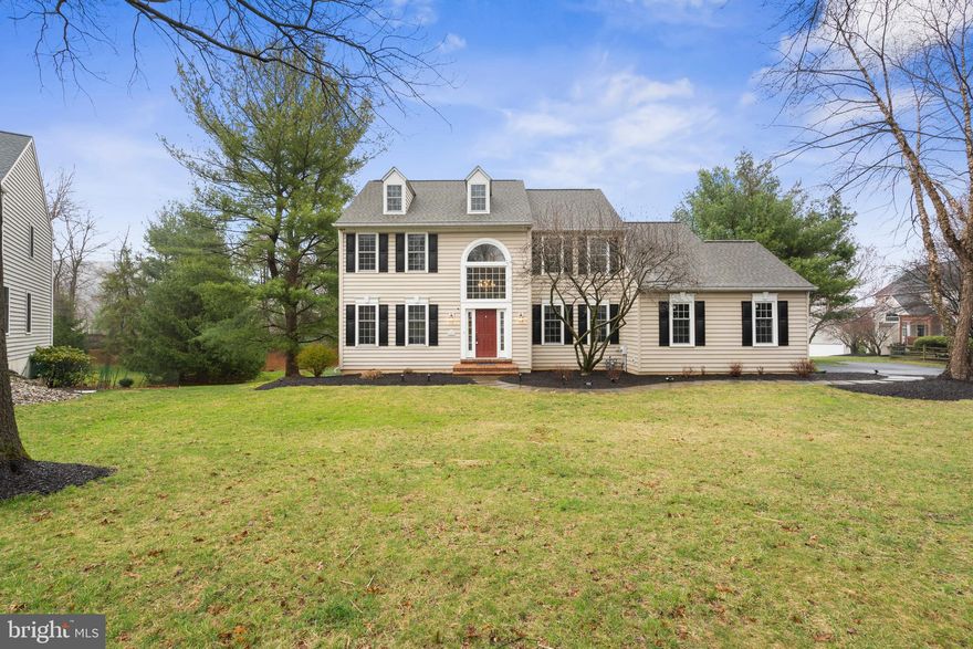 Welcome to 1807 Hawkweed Way, a beautifully designed Meadowlark model by Lee Haller, situated in the highly desirable Summerhill community of Malvern. Tucked away on a peaceful cul-de-sac, this home is set on a generous .46-acre lot, offering plenty of open space and privacy, with mature trees lining the perimeter for added seclusion. Featuring 4 spacious bedrooms, 2.5 bathrooms, and over 3,400 square feet of thoughtfully designed living space spread across three levels, this home is ideal for both comfortable living and elegant entertaining.
Upon entering, you are welcomed by a grand foyer with a striking turned oak staircase and an abundance of natural light from the large windows. The main level showcases elegant formal living and dining rooms, both adorned with beautiful hardwood floors. French doors separate the formal living room from a private study, offering a quiet space for work or relaxation. The expansive family room, with soaring vaulted ceilings and a cozy fireplace, flows seamlessly into the eat-in kitchen, which features hardwood floors, a full pantry, and peaceful views of the elevated deck and backyard. A conveniently located laundry room and access to the two-car garage complete the main level.
Upstairs, the master suite offers a private retreat with its own sitting area, hardwood floors, and a luxurious en-suite bathroom with a skylight and soaking tub. Three additional generously sized bedrooms share a well-appointed full bathroom. The finished lower level provides over 700 square feet of additional living space, perfect for a home theater, recreation room, or additional living area. There is also a separate office/bonus room, which could easily be converted into a fifth bedroom, with plumbing already roughed in for an additional full bathroom. The walk-out lower level leads to a private cobblestone patio, ideal for outdoor relaxation and entertainment.  This home is ideally located with easy access to corporate centers, fine dining, shopping, and the highly regarded Tredyffrin Easttown Schools. Don’t miss the opportunity to make this exceptional property your own!