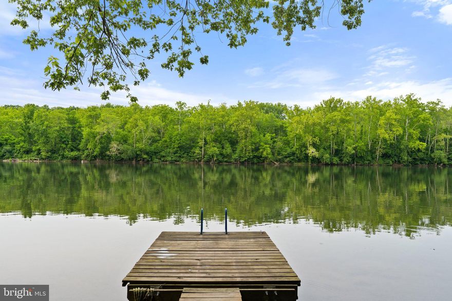 This special property is located near Shepherdstown along the quiet stretch of the Potomac River, named Big Slackwater, above Dam 4. The property's most outstanding feature is its spacious flat lawn along 655’ of private deep water river frontage, providing direct access to 12 miles of navigable, recreational  water. The C & O Canal National Historic Park/Towpath, located directly across the river, provides 184 miles of trails along the Potomac and protects your views  from any development.

Upon arrival, you are greeted by pastoral landscapes of rolling pastures (bring the horses!) and sweeping skies. Continue following the wooded lane to the center on the property where a cozy campsite with small studio cottage and garage are nestled in the trees across from ATV trails. As you approach the waterfront, another clearing to the left serves as the proposed homesite. The location sits atop a bluff overlooking the river and dock below. The tour culminates with the property’s most noteworthy feature — the expansive waterfront. A rare feature of bluff view property is a road to the riverfront; you can drive from the property entrance all the way down to the roughly 1 acre of completely flat lawn along the Potomac. The bluff adds remarkable texture and serves as a backdrop to the lower riverfront portion of the property. Thanks to a wide No-Wake Zone at the public boat ramp one mile upriver, this section of Big Slackwater is very quiet.

Shepherdstown, West Virginia provides the opportunity to experience the perfect work life balance - just 90 minutes or less to DC/Baltimore and national/international airports. Nearby Marc stations make for an easy commute. Historic Shepherdstown is a popular travel destination for weekend getaways and was voted 50 Best Small Towns in the South by Southern Living in 2023. The local community offers nationally recognized dining and lodging, arts & theater, shopping, parks and community events. In your down time there are countless options for outdoor recreation. In addition to the C & O Canal National Historic Park, Harpers Ferry National Historic Park is only 30 minutes away, with museums, restaurants, zip lining, white water rafting, tubing and is home to one of the most photographed spots along the 2000 mile Appalachian Trail. Antietam National Battlefield is also an important nearby destination along with other state parks and historic towns.

Deep recreational fresh water, peaceful wooded setting with bluff views, private dock for watercraft and sunset watching, local amenities, cultural events and more — all waiting for a special owner!