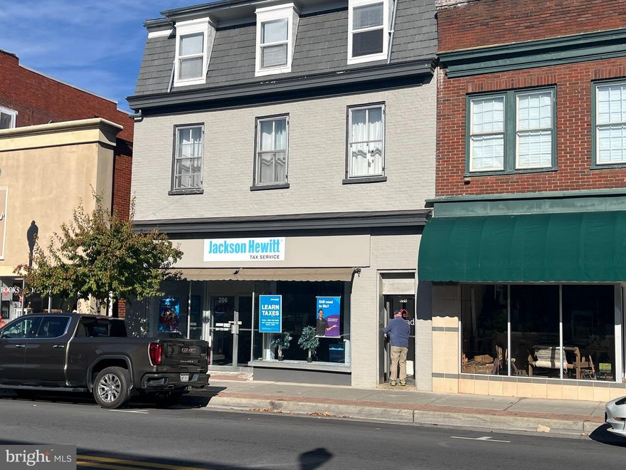 In the heart of historic Charles Town, WV main street 6,245 sq ft commercial /residential mix use building. It feature 800 sq ft store front currently rented to Jackson and Hewitt tax service, 700 sq ft former law office, 940 sq ft rearstorefron(vacant), two very large apartments 2 floor 1,976 sq ft apartment and 3rd floor 1,370 sq ft apartment. Store front and two apartments currently occupied with two commercial spaces vacant but readily leasable. This is an all brick building with new roof and facde in 2019.