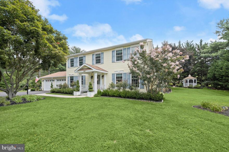 Remarkable and impressive renovation and updating with very high-quality materials throughout.  Thoughtful improvements with care by original owners-both inside and out.  Classic Colonial on lovely 1 acre lot with garden spaces, rear pergola covered no maintenance decking with hot tub, screened gazebo with lighted ceiling fan, elevated garden planters for a variety of species, paver patio rose garden, large shed for your garden equipment; residential sized green house to protect your efforts. Impressive front door with stained glass opens to wide hall flanked by library with access protected by French doors and living room with marble surround gas fire place framed by custom mantle.  The formal dining room with crystal chandelier over-looks the rear decking and yard, all with significant moldings and trim throughout.  The gourmet kitchen is impeccably designed with custom cabinetry to include roll out shelving and cabinet drawers, spice storage, hidden pantry tower; all with soft close features.  Lighted glass china display enhances the beauty of the kitchen and your cooking and dining experience; at either the breakfast bar, table space between the wet bar or onto the four-season sunroom/family room where you and your guests have ample space to relax and enjoy the peaceful surroundings.  The choice of stainless appliances will impress the most discerning chef. The kitchen space opens to the laundry room, private half bath and the garage.  The upper level reveals 4 generous bedrooms;  the primary with two closets and access to the recently renovated primary bath with additional counter to ceiling storage cabinetry, seated shower and marble flooring.  The hall bath provides separate spaces between the tub/shower and w/c and those using the vanity.  It will be a pleasure to settle into this pristine property.  Architectural shingle roof in 2015 with leaf guards, Renewal by Anderson supreme quality windows throughout, new vinyl siding and generator; unfinished basement has opportunity for your in-home gym, hobby room and along with the over-sized garage there is ample storage.  Close enough to hear the marching band on the Glenelg HS field during football season; situated on the lot to provide rear treed privacy, ample space for lawn games all within minutes to Western Regional Park and Library complex, dining and service options; access to major commuting routes to Baltimore, Washington and beyond.   Welcome Home!