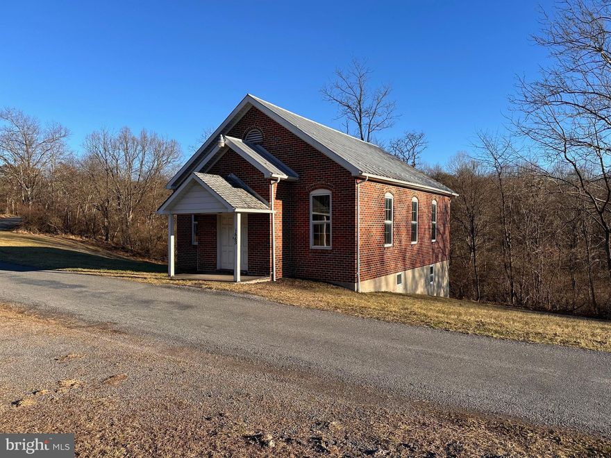 Unique opportunity to own a country church.  Brick exterior and a metal roof.  Sellers never occupied, but encourage any due diligence. Beautiful light comes in through the stained glass windows.  A set of steps leads down to the basement. 2 half baths are in the walkout basement. Was set up with central air and an oil furnace for heat.  Built in approximately 1910.