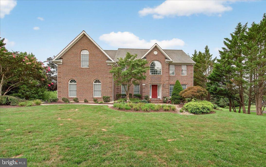 Stately Colonial in the highly sought-after Warfield's Grant neighborhood. This home boasts three impeccably finished levels with four bedrooms and 3.5 baths. The main level is designed for both sophisticated entertaining and comfortable living, featuring a gracious formal living room and dining room, a secluded private office, and a practical mudroom just off the garage. The updated kitchen features high-end finishes, and the upstairs bathrooms have been beautifully renovated. Enjoy the peaceful screen porch or step out from the finished, walk-out lower level to a lovely patio and fantastic, manicured yard. The incredible primary suite offers a luxurious retreat. You won't want to miss viewing this one!