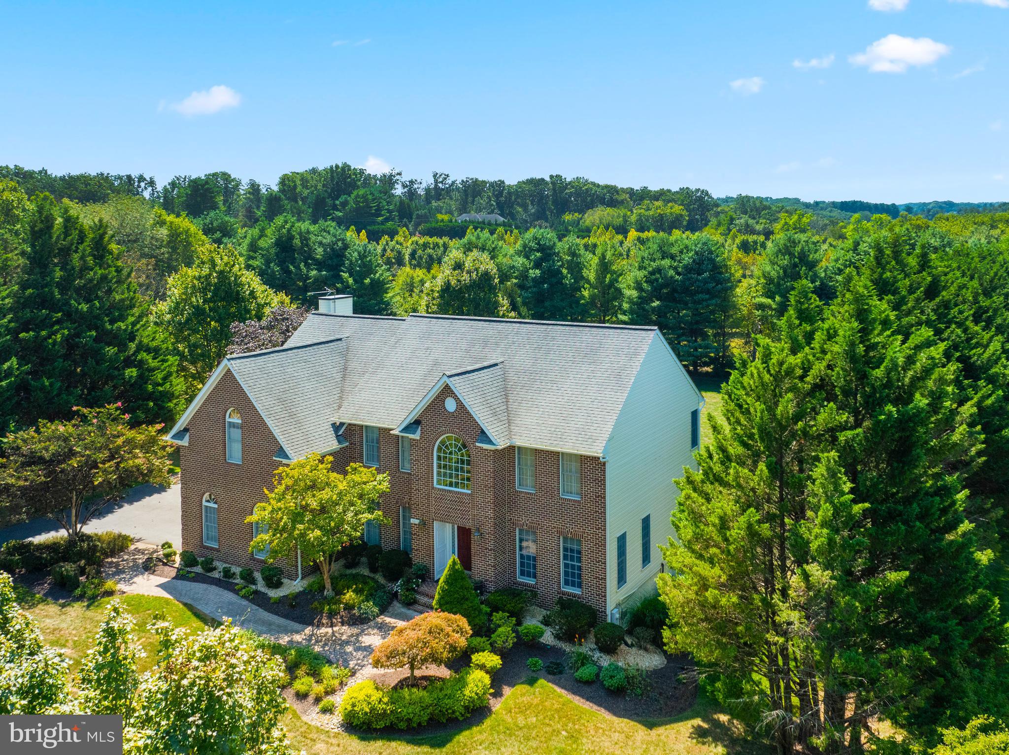 Stately Colonial in the highly sought-after Warfield's Grant neighborhood. This home boasts three impeccably finished levels with four bedrooms and 3.5 baths. The main level is designed for both sophisticated entertaining and comfortable living. Inviting family room off kitchen, a gracious formal living room and dining room, a secluded private office, and a practical mudroom just off the garage. The updated kitchen features high-end finishes, and the upstairs bathrooms have been beautifully renovated. Enjoy the peaceful screen porch or step out from the finished, walk-out lower level to a lovely patio and fantastic, manicured yard. The incredible primary suite offers a luxurious retreat. With NO HOA fees and many major updates/upgrades, you won't want to miss viewing this one!