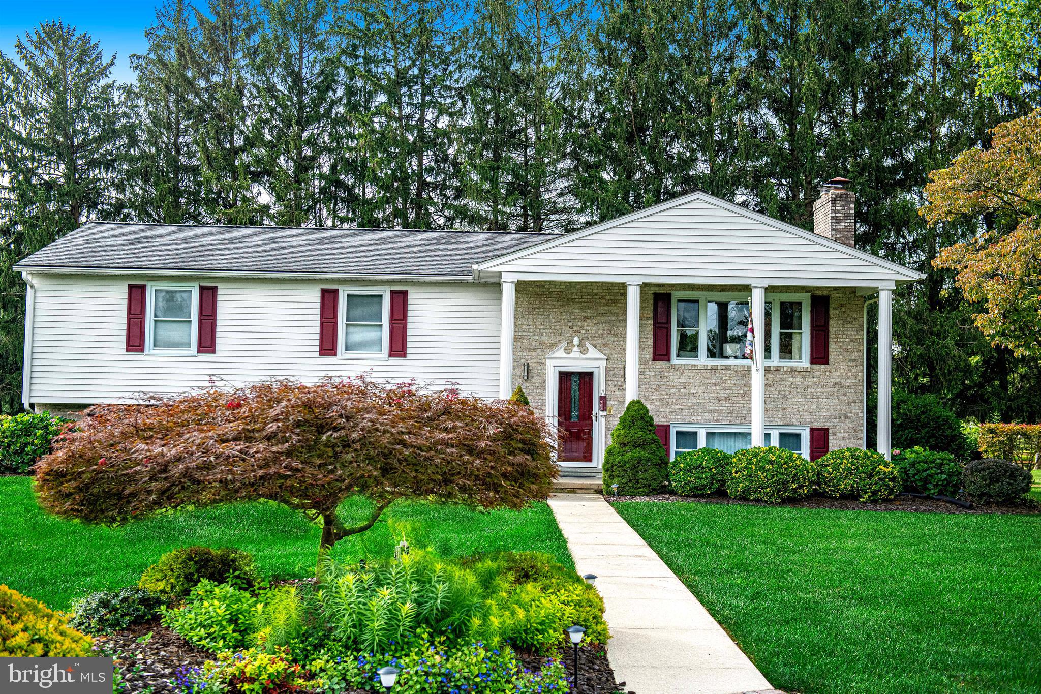 Welcome to the best of all worlds with this charming, well-cared-for home—Kingsville address, Harford County location, and part of the Fallston school district. This beautiful 4-bedroom, 2.5-bath home is located in Pleasant Hills and is perfectly situated on a landscaped corner lot. Gleaming hardwood floors lead you through a light-filled main level, where the gourmet kitchen shines with quartz countertops, glass tile backsplash, and newer appliances. Enjoy effortless indoor-outdoor living with a screened-in porch overlooking lush gardens.
Upstairs, spacious bedrooms and updated baths provide comfort and style, while the lower level offers a cozy family room with a wood-burning fireplace, a guest bedroom, and a half bath. The laundry room doubles as a hobby space with cabinetry and sink. A two-car garage with storage galore and a new $3,000 epoxy floor completes this lower level. From the thoughtful updates to the inviting spaces indoors and out, this home is ready for you to move in and make it your own! Enjoy peace of mind with a new roof in 2020 and a new heat pump in 2025!