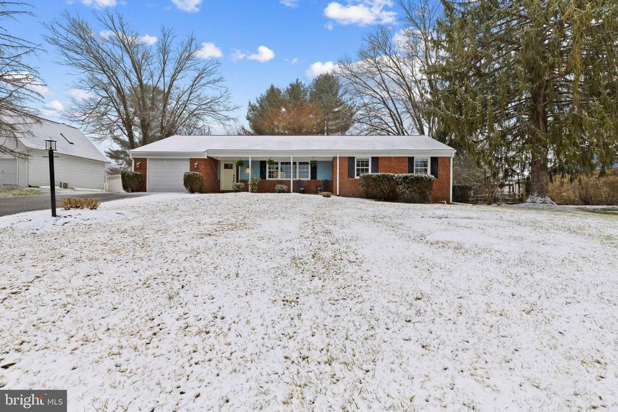 Charming and thoughtfully updated ranch-style residence with classic brick and blue exterior accents, offering 5 bedrooms, 4 full bathrooms (all updated in 2026), 3,244 finished square feet, a 1-car garage with a workbench station, and a fully attached in-law suite in sought-after Valley Mede. With its rare and versatile layout, this home presents exceptional potential for multigenerational living, extended guests, or even income-producing opportunities. A welcoming front porch leads into the beautifully refreshed interior. To the right of the foyer is the open-concept main living area anchored by a stunning eat-in kitchen renovated in 2021. Highlights include an island with modern pendant lighting, stainless steel appliances, Formica countertops, a striking herringbone backsplash, crisp white cabinetry with gold fixtures, and a spacious dining area that flows seamlessly into the inviting living room. The main level continues with a comfortable primary suite featuring double closets and a private en-suite bath, along with two additional bedrooms (one with double closets), another full bathroom, and a centrally located laundry closet with a stacked washer and dryer for everyday convenience. One of the home’s most compelling features is the attached in-law suite—complete with its own private entrance. This fully equipped space includes a full kitchen with stainless steel appliances, white cabinetry, and a coordinating herringbone backsplash, plus a sunlit dining area, while two bedrooms, and a full bathroom with an additional washer and dryer provide complete independence. A generous living room with a brick-accented wood-burning fireplace is thoughtfully designed with access from both sides of the home. This flexible space can function as the in-law suite’s private living area or serve as an additional family room or lounge for the main residence, offering incredible versatility to suit a variety of living arrangements. The expansive, fully finished lower level offers even more living space, perfect for entertaining or recreation, and includes a full bathroom, a separate laundry room with a third washer and dryer, and a utility/workshop room. A pool table conveys for added enjoyment. Additional highlights include a roof updated in 2022, providing added peace of mind. Outdoors, enjoy a large, flat fenced backyard with a patio, walkways, and a storage shed.