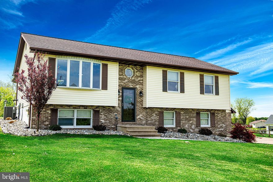 Nestled on a lovely .83 acre lot in the sought-after Conowingo Manor community, offering the tranquility of country living with the convenience of easy access to major routes for commuting. This charming home offers an updated architectural roof (2018) and many more wonderful amenities including a spacious living room that seamlessly flows into an updated kitchen, complete with the cozy ambiance of a pellet stove and recent upgrades including granite countertops (2020) and luxury vinyl plank flooring (2019).Step through the French doors into a light filled sunroom, providing the perfect retreat. An additional French door leads to the expansive 20 x 12 screened-in covered deck, ideal for relaxation and outdoor enjoyment. The owner's en-suite offers a private haven, featuring an updated full bathroom (2018) and sliding door to provide access to the covered deck, which overlooks the beautiful backyard setting. Two additional bedrooms and another updated hall bathroom (2018) complete this level. The lower level offers a versatile den or potential fourth bedroom, along with a separate laundry room equipped with newer washer and dryer (2021), and access to the oversized two-car garage. But wait, there's more! An incredible 2 1/2 car detached garage with attic space is perfect for the car enthusiast or provides ample storage space & workshop possibilities. This home truly has it all and is just minutes away from everything you need. Your Home Sweet Home awaits, so don't hesitate to make it yours today!