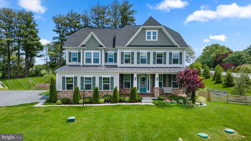 Welcome to your dream home! This captivating 4-bedroom residence boasts an array of exquisite features that elevate modern living to new heights.Set against wonderful bucolic views and captivating sunrises over the farmland, this home offers a serene retreat from the hustle and bustle of everyday life.

As you step inside, you're greeted by the charm of open-concept living on the first level. The heart of the home is a chef's delight, featuring a gorgeous white kitchen with beautiful cabinetry and hardware, glass front cabinets, and stainless steel appliances including a gas cooktop and double wall oven. The centerpiece is a large center island with a farmhouse sink and bar-height seating, perfect for gatherings and culinary adventures. An exquisite porcelain tile backsplash and sleek quartz countertops add a touch of luxury, while the butler's pantry provides additional storage and functionality.

Adjacent to the kitchen, the family room beckons with a cozy fireplace, ideal for relaxation and entertainment. A first-floor office, entered through elegant French doors with a transom overhead, offers a serene space for work or study.

The dining area, bathed in natural light, opens to a large covered rear porch, leading to a spacious patio with a stone fireplace—perfect for outdoor dining and enjoying the serene surroundings. A convenient half bath on the main level and a mudroom upon entry from the garage add to the home's practicality and convenience.

Hardwood floors grace most of the main level, continuing upstairs, where you'll find four bedrooms, including an expansive owner's suite with a tray ceiling, a closet suite, and an ensuite bathroom with double sinks, a large shower, and a separate tub. Two bedrooms share a well-appointed bath, while the fourth bedroom enjoys its own private bathroom.

The upper level also features an expansive laundry room with a sink, adding ease to daily routines.

The fully finished lower level offers even more living space, with luxury vinyl plank flooring and recessed lighting creating an inviting atmosphere. A full bath and an additional room with sliding barn doors offer versatility, perfect for a home gym or a second office. With a walk-up to the patio, the lower level seamlessly extends your indoor living to the outdoors.

This immaculate home is adorned with neutral paint throughout, complemented by beautiful light fixtures and meticulous landscaping. A large newly fenced back yard (installed in 2023) provides privacy and security, while the two-car garage offers convenience and storage options.

Additional features include a new whole-house water filtration/softener system and a reverse osmosis system for the kitchen water supply, ensuring both comfort and quality in everyday living.

Don't miss the opportunity to make this extraordinary property your own—a perfect blend of luxury, comfort, and functionality awaits you!