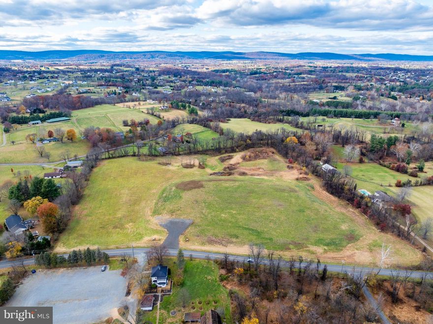 Gorgeous 17+ acre property in Hamilton! Rare opportunity to own a large, scenic parcel with no HOA and AR-1 zoning, allowing for a wide variety of by-right uses. This stunning property offers breathtaking panoramic mountain views, open pastoral land, and is conveniently situated between Route 7 and Route 9, just minutes from downtown Leesburg and approximately 20 minutes to Dulles Airport. The property features an installed high producing well and an approved septic drain field, and sits directly across from The Barns at Hamilton Station Vineyards. The previously expired grading bond that had been in place for nearly a decade has recently been removed, and the property has passed final inspection.