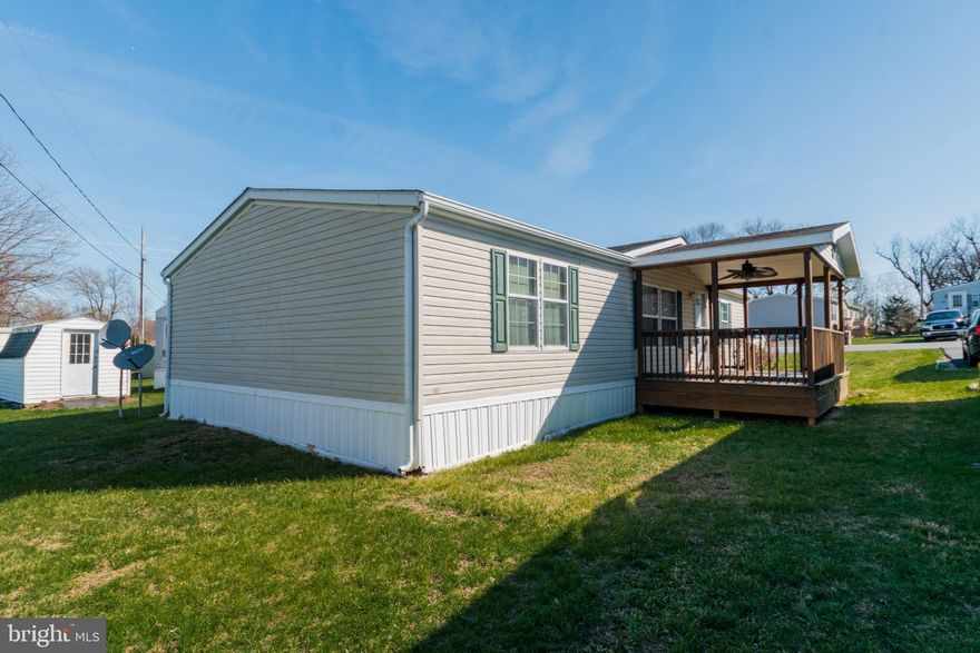 HUGE PRICE ADJUSTMENT!!  MOTIVATED SELLER!! BRING YOUR OFFER TODAY!!   Welcome home to this beautifully maintained 2007 double-wide manufactured home offering 1,279 sq ft of comfortable living space. This inviting 3-bedroom, 2-bathroom home features a bright and functional layout designed for both everyday living and entertaining. The spacious family room flows seamlessly into the dining area, creating an open and welcoming atmosphere. The kitchen offers plenty of storage, including a convenient pantry, while the nearby laundry room comes complete with a washer and dryer for added convenience. Each bedroom features its own walk-in closet, providing excellent storage throughout the home. The primary suite serves as a relaxing retreat with a soaker tub in the private bathroom—perfect for unwinding at the end of the day. Step outside and enjoy the covered 10x16 deck, ideal for morning coffee or evening gatherings. The property also includes a paved driveway and a 10x12 storage shed, offering extra space for tools, hobbies, or outdoor equipment. Major updates add peace of mind, including a new roof (2019/2020) and a water heater replaced in 2023/2024. This well-cared-for home offers comfort, practical storage, and great outdoor features—ready for its next owner to move in and enjoy!   **Original homesite on a rented lot. Prospective buyers must apply to Roselandcommunities to be approved to the park. Application fee is $25 for each adult that is going to be on title. Lot rent is $450/mo with a security deposit of $225. Lot rent includes snow plowing of the roads, maintenance for the common (grass) area, playground, basketball court and pavilion with picnic tables**