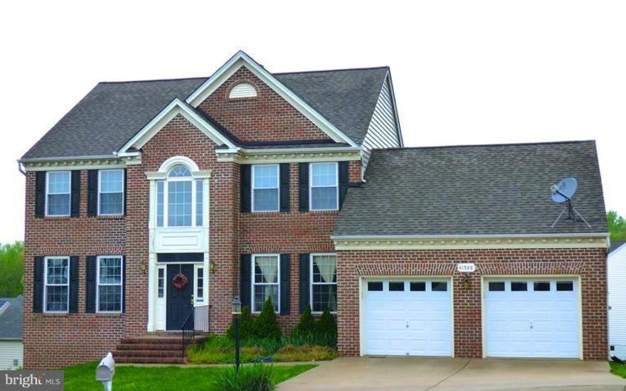 This home has never been smoked in! Many upgrades to include recessed lighting, corian countertops, crown molding, tray ceiling, chair rail, two story open foyer and more!  Second master bedroom in fully finished walk out basement.  Full bath in basement is handicap accessible.  This large 4000 sq home will impress!