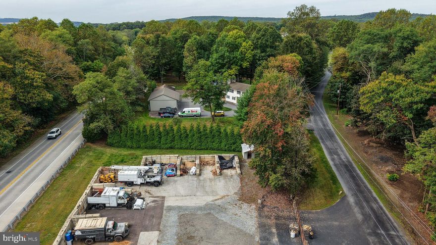 Prime business opportunity with built-in revenue streams, highway visibility, and flexible zoning! Situated on 4.7 acres with over 2,200 feet of road frontage between Bucktown (Rt. 23 & 100) and Morgantown (Rt. 10, 176 & PA Turnpike), this mixed-use property is zoned R2/B2, which permits a wide range of commercial uses—offices, bank, hotel/motel, restaurant, garden center, and more.

Currently operating as Warwick Auto Body, the established and reputable shop is fully equipped for a new owner. The property features 1,200 sqft garage connected to 960 sqft- 24x40 pole barn & 800 sqft- 24x32 pole barn, 7 garage bays in total, including a main garage outfitted with a 10,000 lb. hydraulic lift, dual 80-gallon air compressor tanks (7.5 HP each), and many additional negotiable tools, making this a turnkey opportunity for an auto business. Financials are available upon request.

Additional income streams are already in place: a portion of the property is rented to a landscaping company for bulk storage, with concrete bin blocks ready for mulch, stone, and more. This lease is below market value, allowing immediate potential for increased rental income.

The property also features a 2,628 sq. ft. residence with 6 bedrooms, 3 bathrooms, 2 kitchens, and 2 laundry rooms. This space can serve as employee housing, an on-site manager’s residence, or an additional rental unit. A two-level deck, office space, and modern updates make the home comfortable and functional.

With two large pole barns, 7 garage bays, a commercial-grade septic system (cleaned annually), private well, and excellent location, this property is perfectly positioned for entrepreneurs and investors alike. Whether you’re continuing the auto body business or developing a new venture, this property offers unmatched visibility, infrastructure, and income potential.