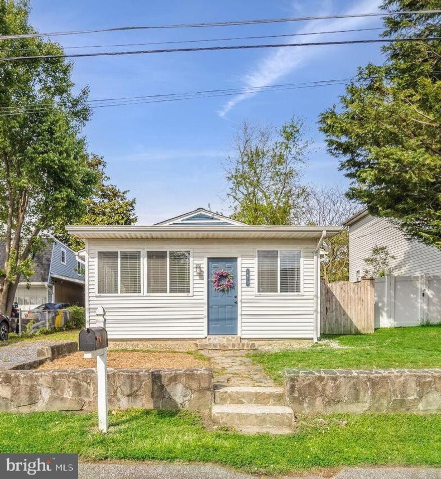 *OFFER DEADLINE SUNDAY 6/4 @ 8PM*

Adorable cottage on a charming street less than a block from the water! This 2 bedroom/1.5 bath boasts a bright sunroom, open concept living and dining, an updated kitchen, all hard surface flooring, and a great fenced in yard. Water privileged community includes beaches, boat docks, community piers and playgrounds! This is a fantastic opportunity!