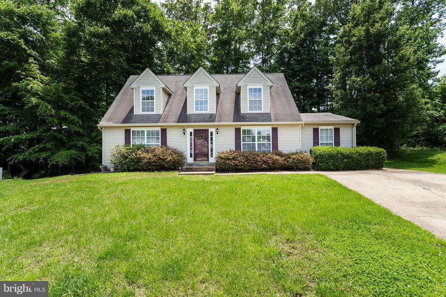 Charming Cape Cod!  Beautiful open kitchen w/breakfast area, Cherry cabinets, Stainless Steel Appliances & Granite.  Huge Dining Room & Family Room.  Vaulted ceilings, Two Story Foyer.  Main level master bedroom & laundry.  Upstairs bedrooms are spacious.  Roof 3 years old! Lots of windows and mature landscaping.  Close to wonderful schools, shopping & I-95.