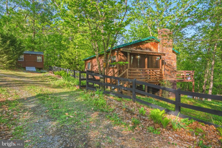 Embrace the beauty of nature from the comfort of this updated 2 bed 1 bath cabin, where modern convenience meets rustic charm. Whether you're gathered around the fireplace or soaking in the sights from the back deck overlooking the mountains, you'll feel right at home in this idyllic retreat." Many recent upgrades including: New metal roof (2021), wood siding was freshly stained, granite counter tops, new cabinets, new kitchen sink, new stove, new microwave, new logs in the fireplace, updated bathroom, new storage shed, new hot water heater (2021), new laminate flooring throughout, Tongue and groove ceilings and walls. This property is turn key and ready to move into as a permanent residence or weekend retreat.  Septic was pumped and inspected in 2021.
HOA does not allow Short term rentals.