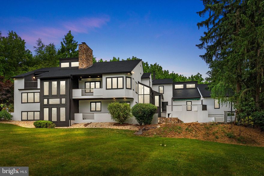 Nestled in the serene countryside of Chester Springs, Pennsylvania, 1081 Yellow Springs Drive presents a rare opportunity to embrace the tranquility of rural living while enjoying the comforts of modern luxury. Spanning across two expansive lots totaling 8.3 acres, this property offers a picturesque landscape complete with a tranquil pond and babbling stream, creating an idyllic retreat for nature enthusiasts.Boasting over 6000 square feet of meticulously crafted living space, this contemporary home welcomes you with a grand two-story atrium, flooded with natural light and architectural elegance. The main level features a spacious floor plan with seamlessly integrated living, dining, and entertaining areas, adorned with architecturally exposed wood beams that add rustic charm and character.The heart of the home lies in its gourmet kitchen, equipped with premium appliances, custom cabinetry, and a center island, perfect for culinary enthusiasts and hosting gatherings with loved ones. Retreat to the inviting master suite, complete with a loft offering access to a private roof deck, where you can unwind and soak in the breathtaking views of the surrounding park-like landscape.. Additionally, the property features a stream and a small pond, further enhancing its natural allure and providing endless opportunities for outdoor recreation and relaxation.Home also features an Au pair/ guest living area with kitchenette and full bathroom.Experience the epitome of country living combined with contemporary sophistication at 1081 Yellow Springs Drive—a sanctuary where every detail has been thoughtfully curated to offer a lifestyle of unparalleled luxury and serenity.