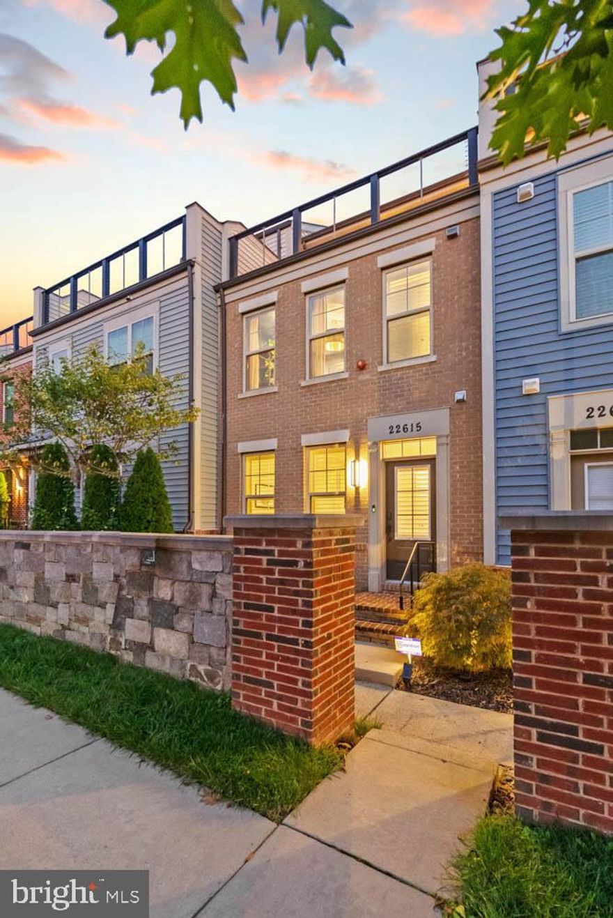 Welcome to this beautiful townhome with a rooftop terrace featuring 3 bedrooms, 3 full bathrooms, and 2 half bathrooms. Built in 2018, this all-brick-front home combines thoughtful design with recent upgrades.

The open-concept main level offers a modern white kitchen with granite countertops, stainless steel appliances, and a large island with seating. The kitchen flows into a bright dining area and living room with a gas fireplace.

Upstairs, the primary suite features a tray ceiling, dual vanity bath with a walk-in glass-enclosed shower and seat, and a private wet bar with sink and mini refrigerator just outside the suite. Two additional bedrooms and full baths complete the upper levels.

Notable updates include all new engineered hardwood flooring and refinished stairs (October 2024). Custom Norman plantation shutters are installed throughout the home, including terrace doors and sliders.

The rooftop terrace overlooks greenery and offers an additional space for relaxing or entertaining. A two-car attached garage completes the property. Conveniently located just off I-270, this home provides easy access to commuter routes, shopping, and dining.