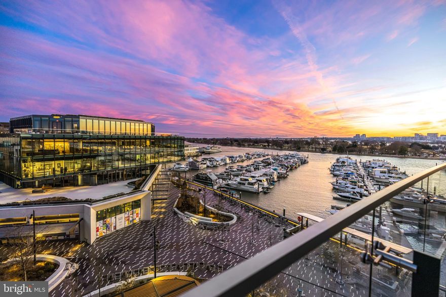 Experience elevated waterfront living in this stunning 2-bedroom, 2.5-bathroom residence at The Wharf’s premier Amaris. Designed by world-renowned architect Rafael Viñoly, this 1,610 sq. ft. condo seamlessly blends modern elegance with timeless design. Step inside from your private in-unit elevator and be greeted by floor-to-ceiling windows framing breathtaking Potomac River views. The open-concept living and dining areas flow effortlessly onto a spacious 310 sq. ft. balcony, perfect for enjoying serene sunrises over the water.

The gourmet kitchen is a chef’s masterpiece, featuring custom Italian cabinetry by Stevali, honed marble countertops, a full-height marble backsplash, and a waterfall-edge island—all complemented by a premium Thermador and Bosch appliance suite. The primary suite is a private sanctuary with a spa-inspired ensuite bathroom featuring exquisite natural stone finishes, a floating vanity, a standalone soaking tub, and a glass-enclosed shower. The walk-in closet offers built-in shelving for optimal storage. The secondary bedroom, complete with a private bath, provides luxurious comfort—ideal as an office or guest suite.

Additional features include wide-plank European oak flooring throughout, a dedicated walk-in laundry room with a utility sink vanity, and two secure garage parking spaces with a private storage unit.

Amaris redefines luxury living with an exclusive collection of world-class amenities designed for comfort, wellness, and entertainment. Unwind year-round in the indoor saltwater lap pool and spa suite, featuring a sauna, steam room, and private treatment rooms. Stay active in the state-of-the-art fitness center, equipped with private training rooms and top-tier equipment. The elegant residents’ lounge provides an inviting space for gatherings, while the private screening room offers an immersive entertainment experience. Outside, the expansive waterfront terrace boasts fire pits, lounge seating, and an alfresco dining area. With 24/7 concierge service, valet parking, a dedicated porter, and a full-time front desk staff, every detail is seamlessly handled to enhance your living experience.

Nestled in the heart of The Wharf, Washington, D.C.’s most vibrant waterfront destination, Amaris offers a lifestyle of unmatched convenience and sophistication. With over 75 world-class restaurants, high-end boutiques, live music venues, and a picturesque marina, The Wharf is a dynamic blend of energy and elegance. Whether indulging in Michelin-star dining, attending concerts at The Anthem, or enjoying waterfront activities like kayaking and boating, life at Amaris is a seamless fusion of luxury, exclusivity, and the vibrancy of The Wharf.