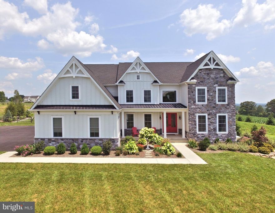 This stunning and impeccable custom 3-year new home has a magnificent setting on almost 3-acres, and steps to Lake Galena!!! This luxurious estate home boasts 4856 sq. ft. Hardwood flooring runs throughout the open floor plan.  The designer gourmet kitchen features a new coffered ceiling, quartz counter tops and backsplash, a metal hood, quartzite on the oversized island, and a pantry with desk nook. The exquisite staircase runs from the basement to the walk-up attic.  Magnificent 2-story family room features stained white oak beams, a regal stone wall  with gas fireplace  and  a built-in TV with shelving. The formal cozy dining room also has the stained white oak beams with plantation shutters. There is also a living room/gathering room and double doors to a private study. The roomy primary bedroom has a tray ceiling and plenty of walk-in closet space. The lavish en-suite has a soaking tub as well as an oversized glass shower. Each bedroom has it's own private bathroom. Don't forget the laundry room is on the 2nd floor. Exiting the sliding door from the breakfast area you will discover the newly finished backyard space. The covered patio with stone fireplace is so peaceful.  Outstanding one year old salt pool with lush landscaping and LED lighting. Built-in barbeque area and free standing hot tub. All this is fenced in.  This gorgeous home is located in Central Bucks School district.  Don't miss this gem!!!!!